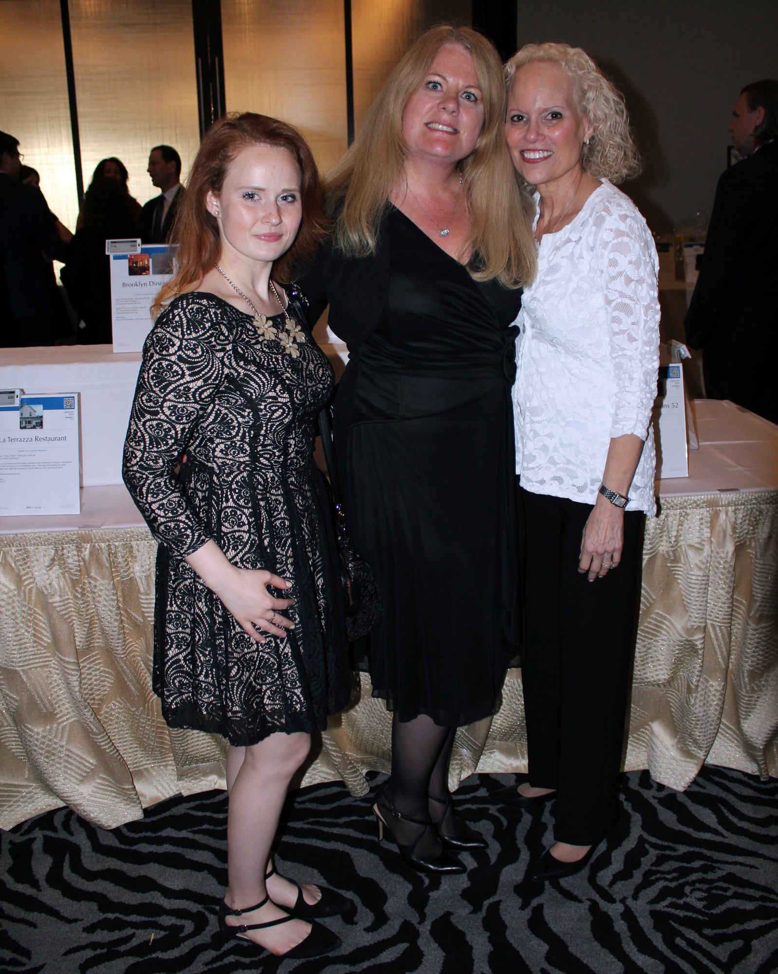 Kaitlyn Clifford, left, Kristin Reilly, and Suzanne Kornblatt at the SIBSplace Auction at Seawane Club in Hewlett Harbor on May 7.