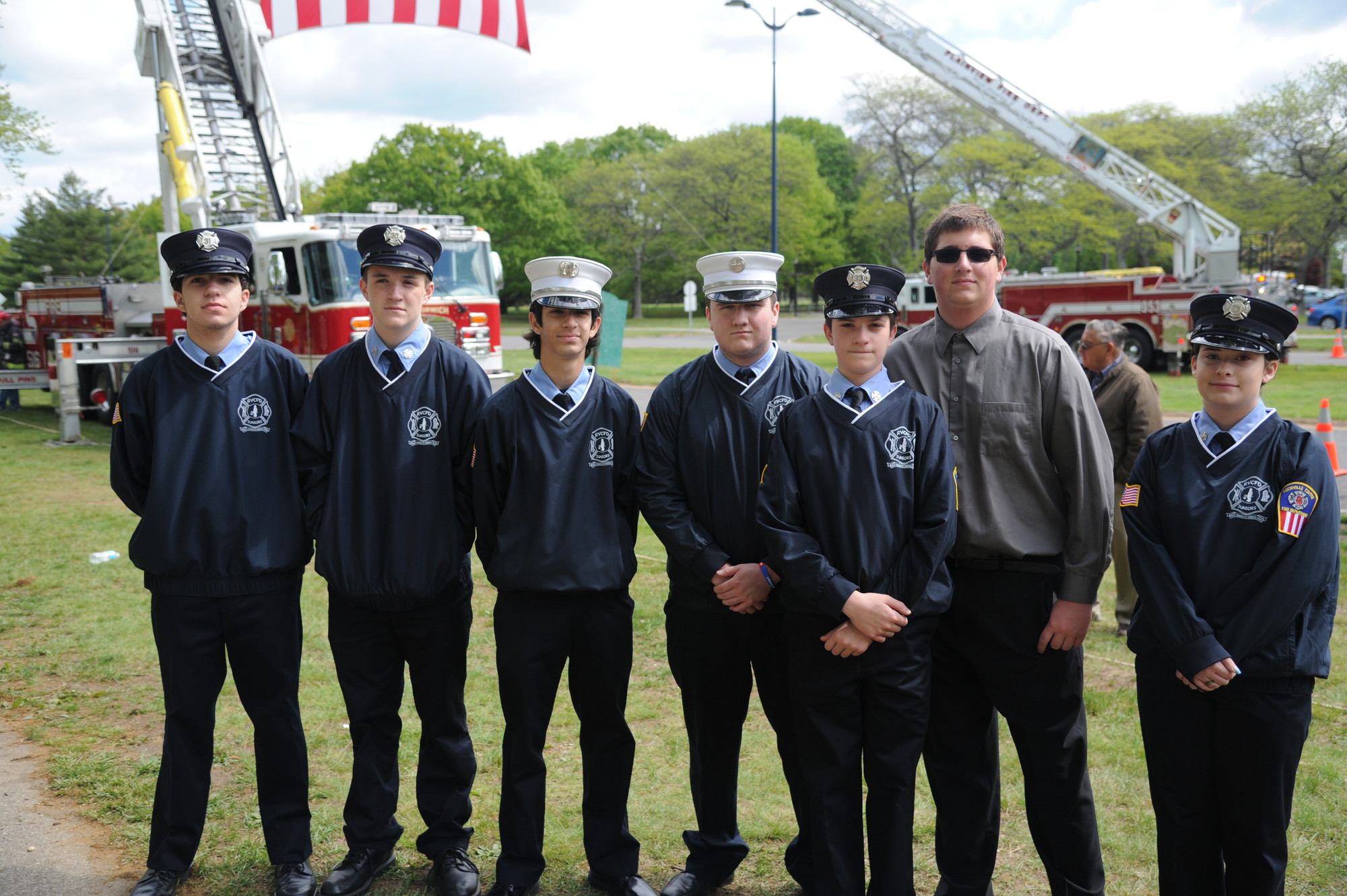 Junior members of the Rockville Centre Fire Department — Ryan Russell, Michael Murphy, John Cook, Pete Gibney, George Barrett, Robert Spaulding and Erika Brancato — came out to see the monument.