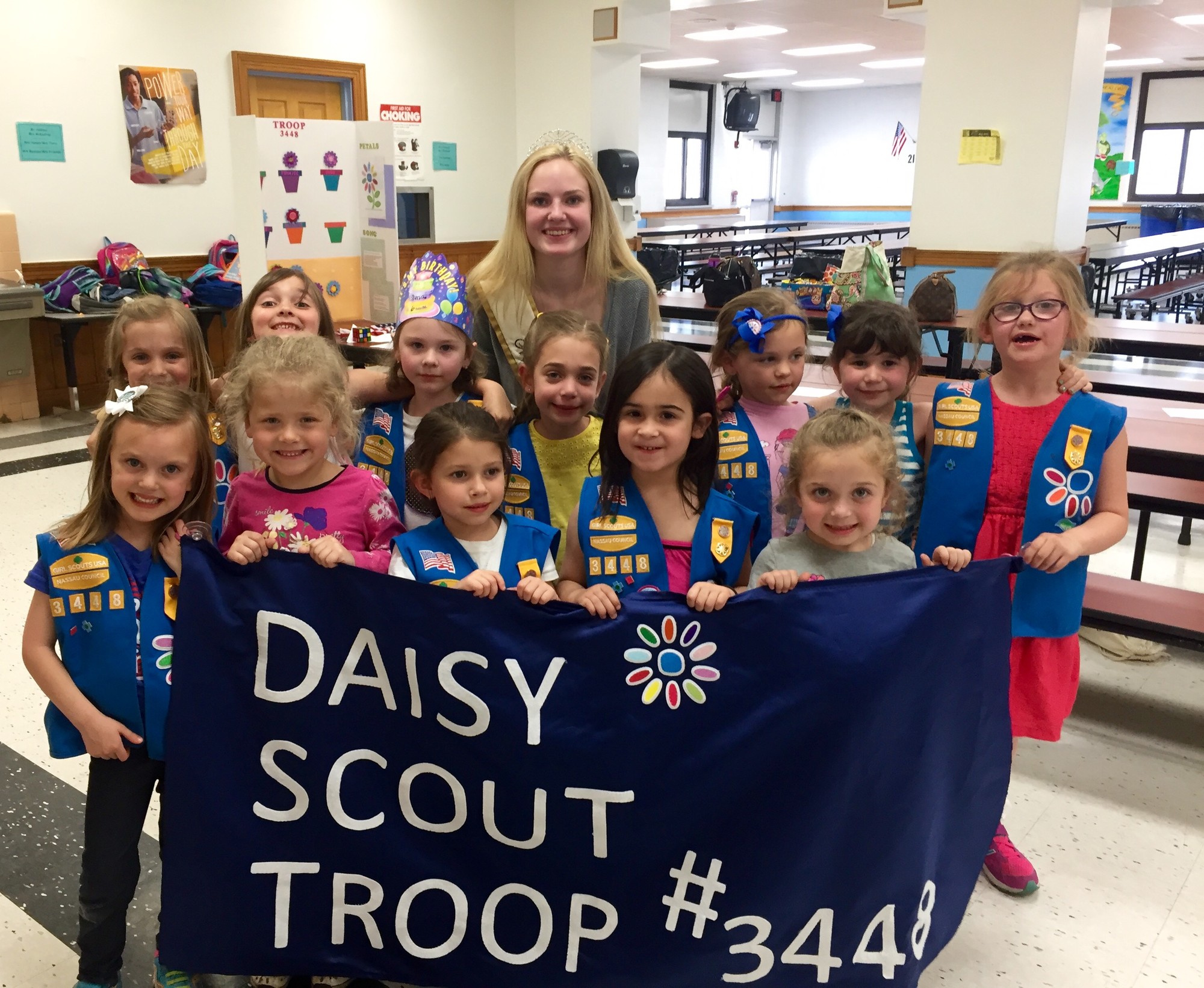 Daisy Scouts are excited to show off their banner in the Wantagh Memorial Day parade on Monday, made with the help of Miss Wantagh, Keri Balnis.