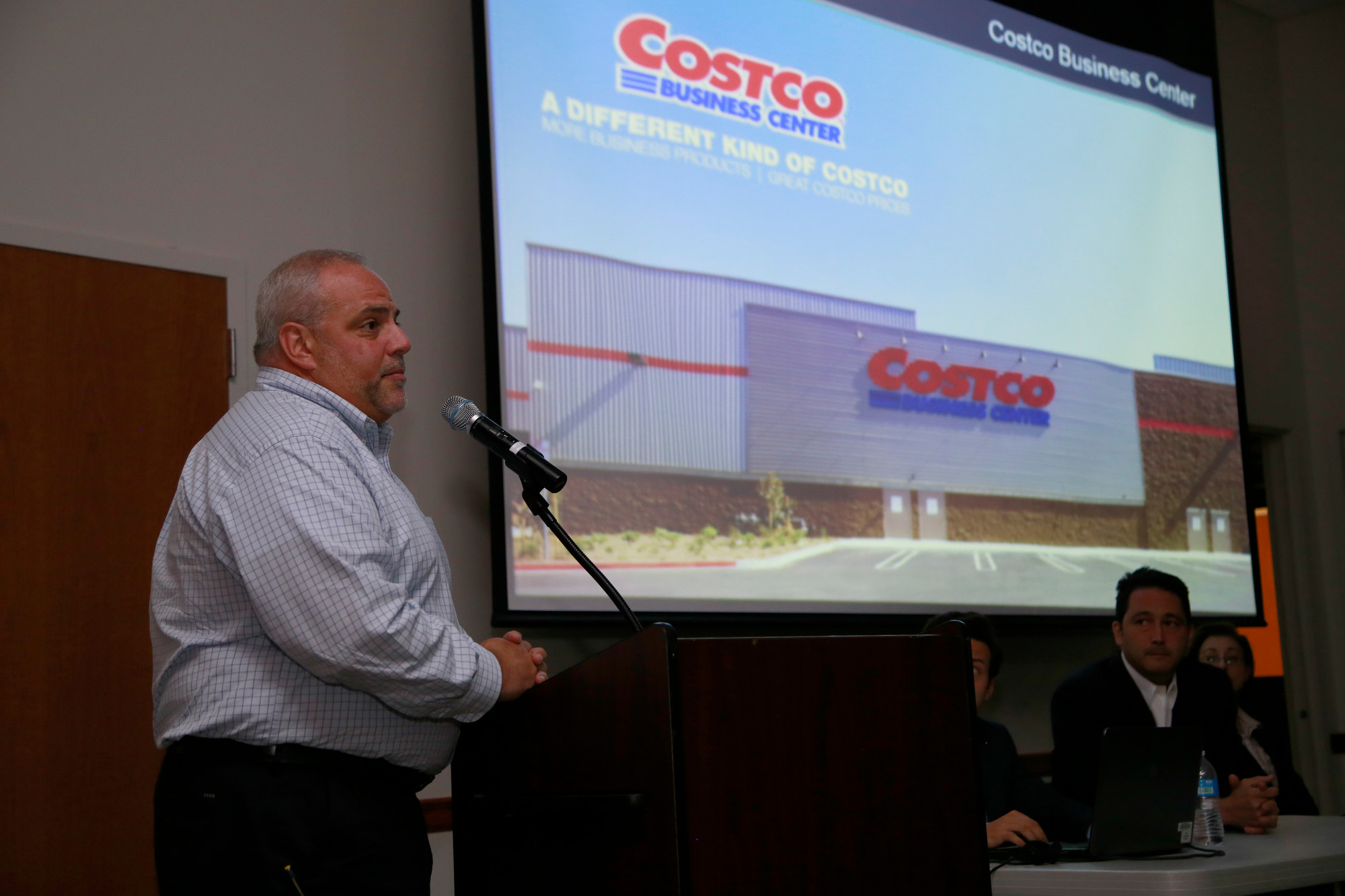 Joe Montesano, left, a representative of Costco, explained the impact that the retailer would have on the community.