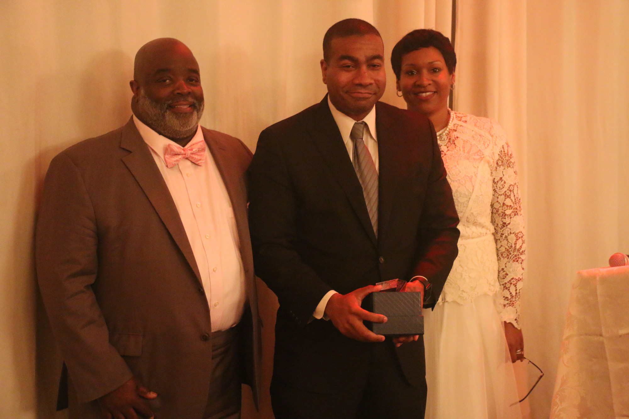 Deputy Mayor Dermond Thomas, center, was recognized for his service in village  government by Philip Jones and the Rev. Kymberley Clemons-Jones.