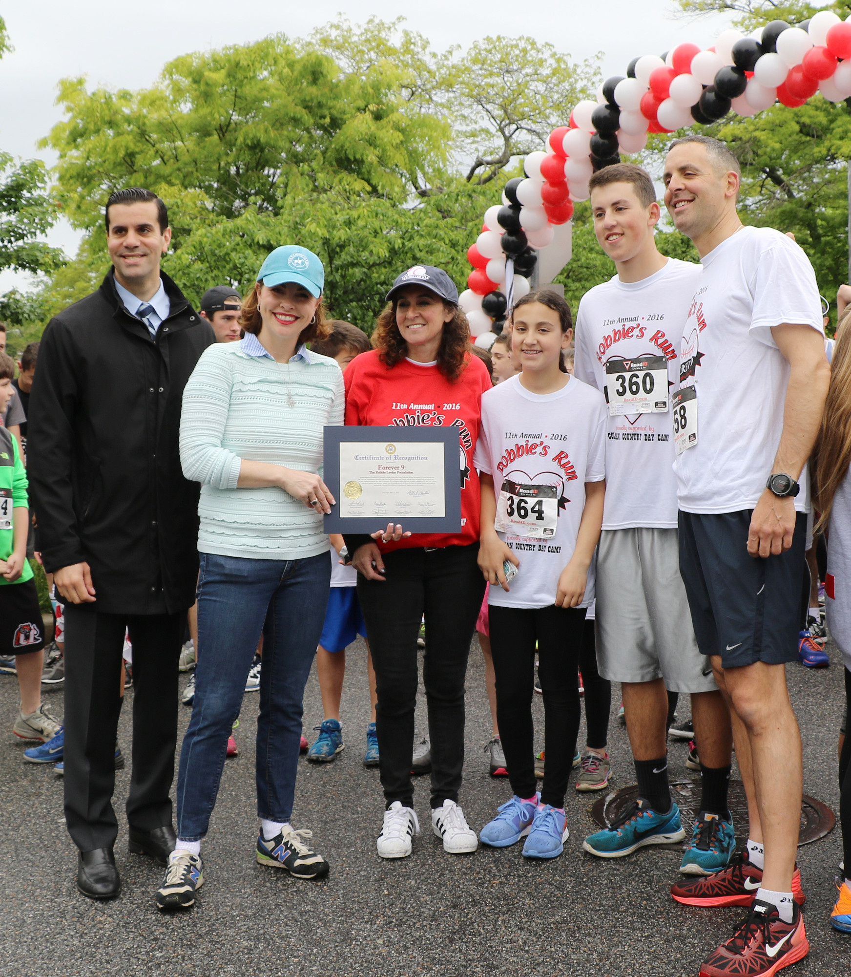 Hundreds attended the event, including, from left, State Sen. Michael Venditto, Town of Hempstead Councilwoman Erin King Sweeney, and the Levine family ––Jill, Rylie, 9, Josh, 17, and Craig.