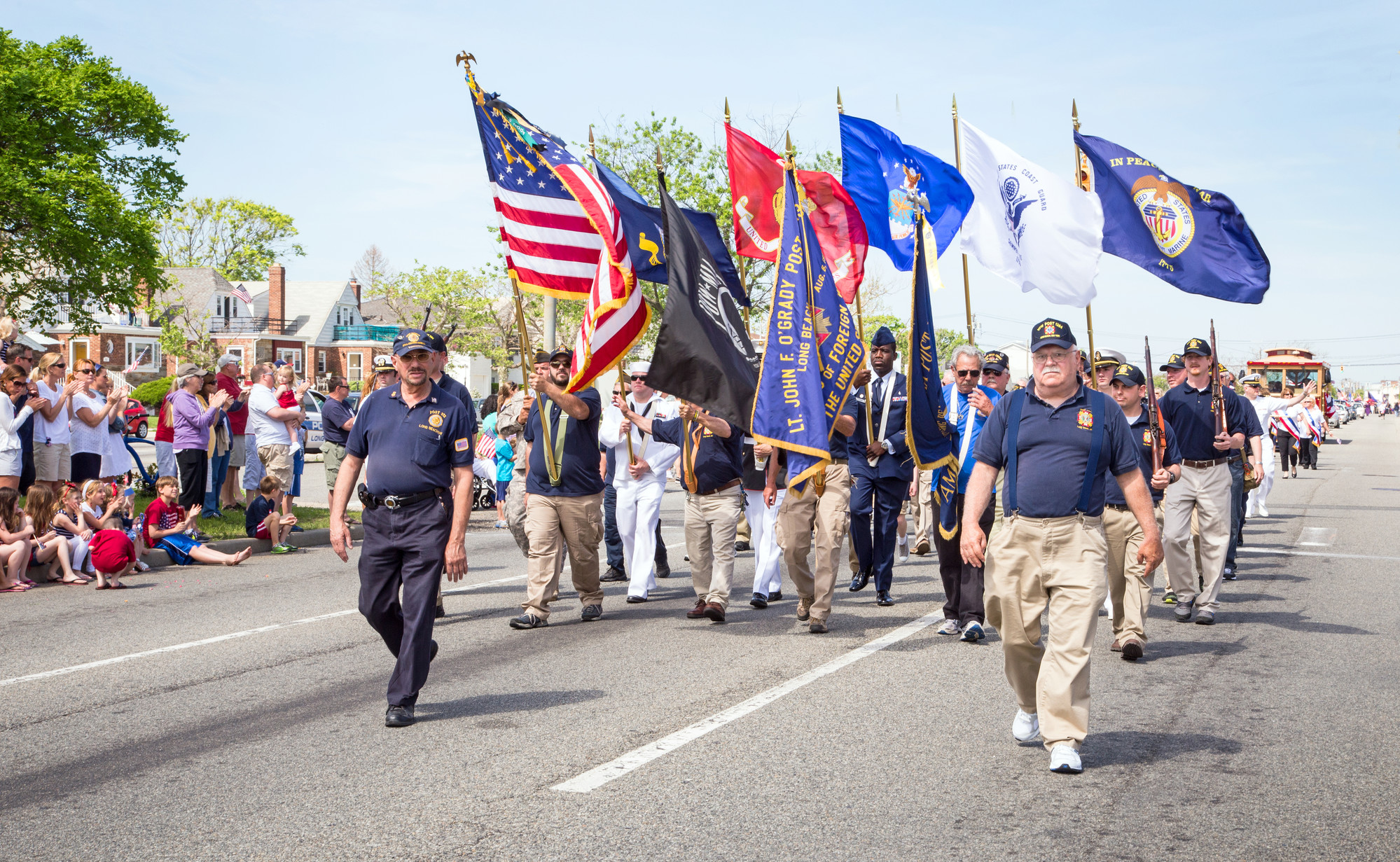 Members of the Lt. John F. O’Grady VFW Post 1384, led by Commander Dan MacPhee, front right, marched in the 2014 Memorial Day Parade. (Kristie Arden/Herald)