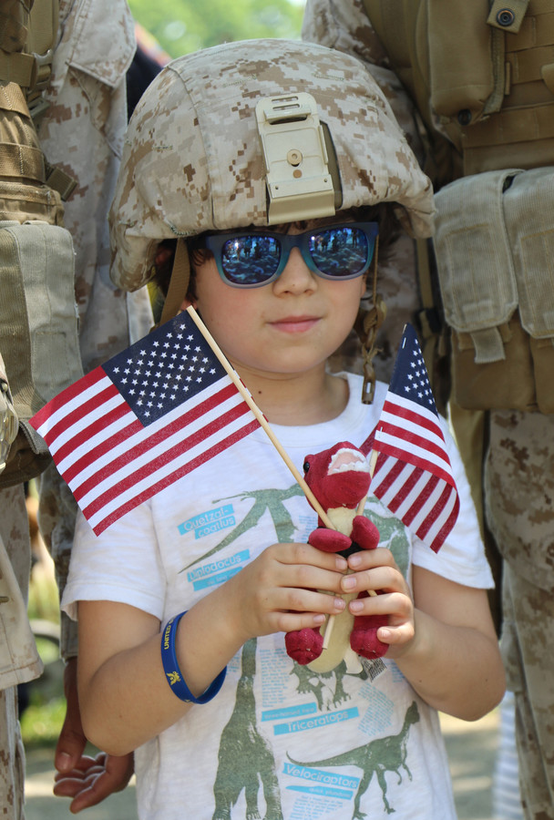 Christian Lopez, 8, showed his patriotism while waiting for the helicopters to land.
