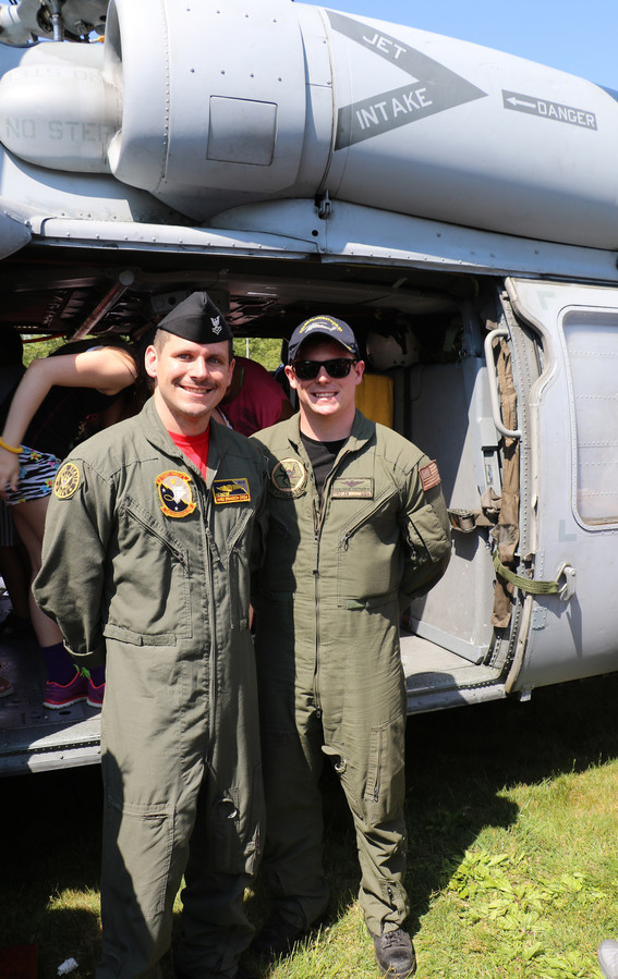 Brandon Drew and David Loeffer happily greeted residents and showed them military equipment.