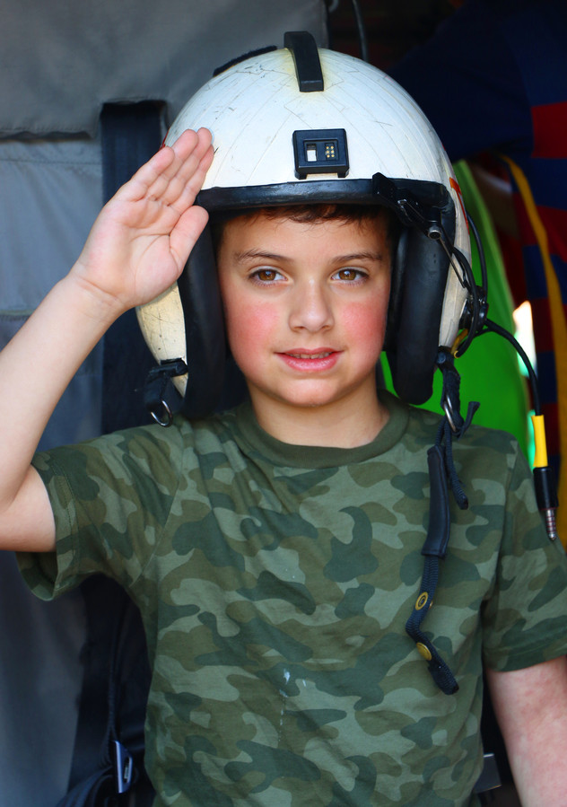 Thomas Mazza, 6, saluted members of the Navy.