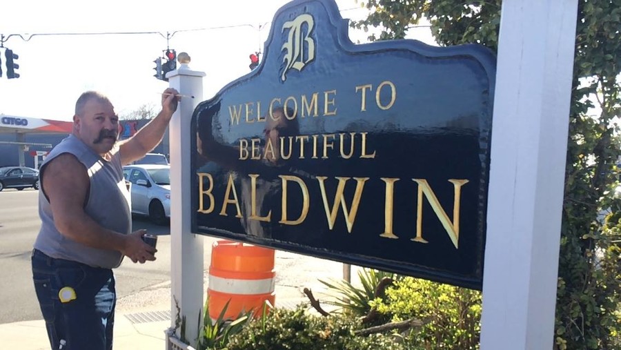 Baldwin native Bill Brown handcrafted a new welcome sign after the previous one was vandalized last summer.