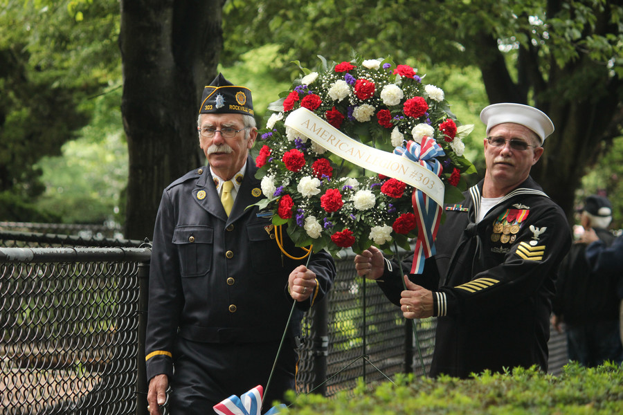 Former American Legion Commander Michael Lapkowski, left, and Navy veteran Paul Kuchler, presented a wreath in the memory of fallen soldiers at the Memorial Day ceremonies in Rockville Centre.