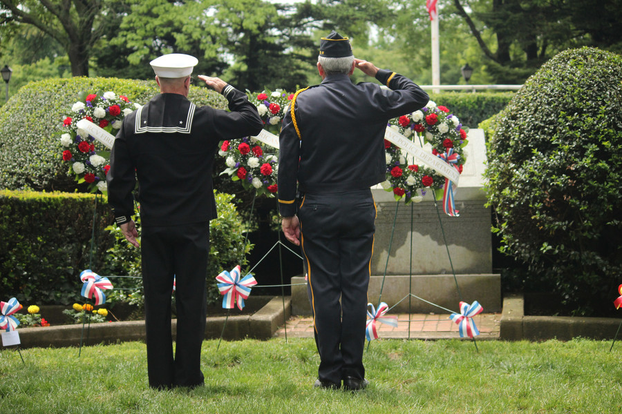 Though the parade was rained out, Rockville Centre still paid tribute to its heroes on Memorial Day. Above, Navy veteran Paul Kuchler, left, and past American Legion Commander Michael Lapkowski saluted fallen soldiers at the memorial park at the Recreation Center on May 30.