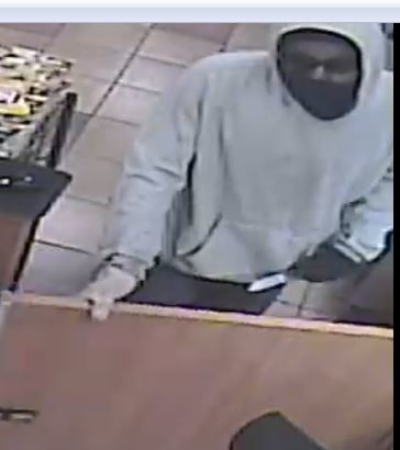 Surveillance footage of the knife-point robber hitting a Subway sandwich shop in Bayside.