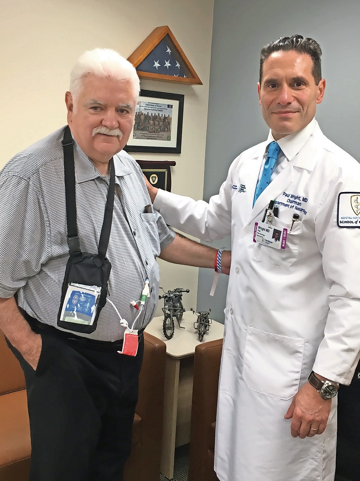 Former RVCPD Commissioner Jack McKeon, left, was one of the first people on Long Island to receive a new treatment for Parkinson’s Disease. Doctors Jaydeep Kadam and Kostas Sideridis, from Northwell Health's gastroenterology unit, performed the quick surgery to install a medication pump, which allows McKeon to live tremor-free for up to 16 hours a day. He's pictured here with his neurologist, Dr. Paul Wright.