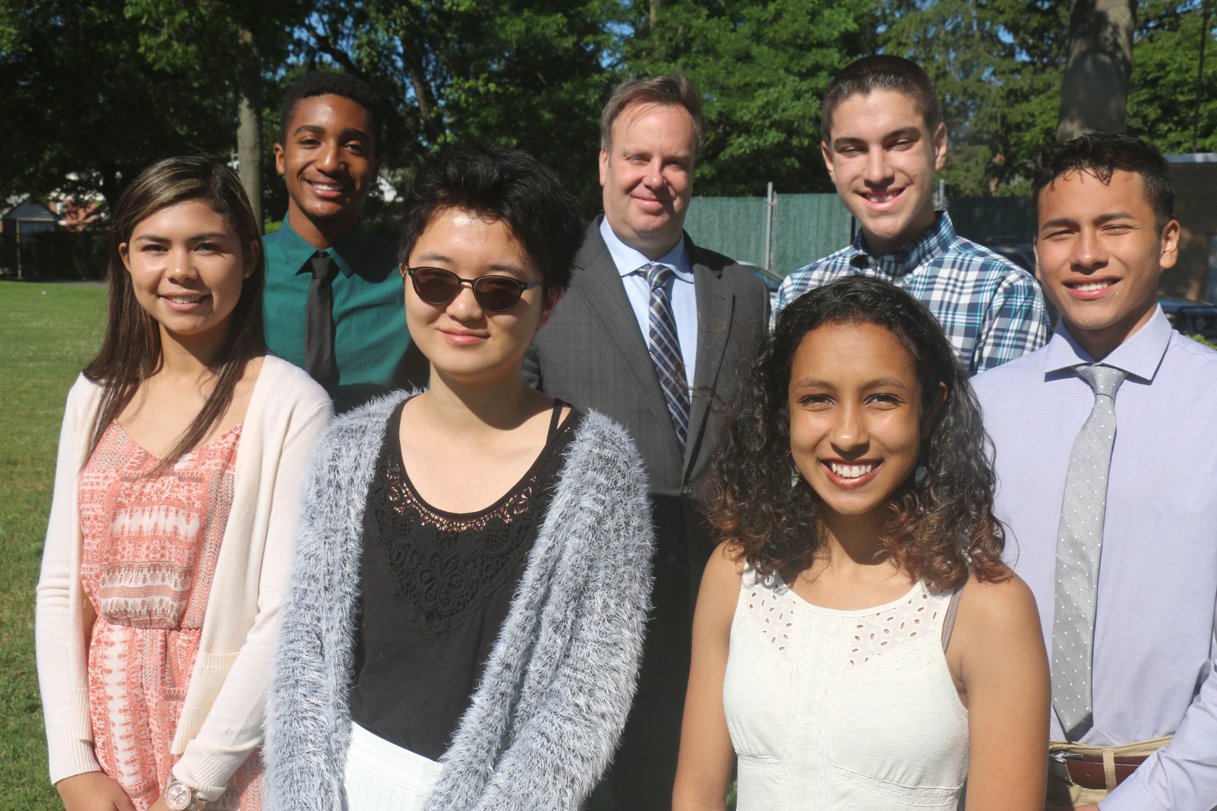 Superintendent Bill Heidenreich, center, with, clockwise from left, Tiffany Longarzo, Ashton Dacon, Thomas Elbert, Jason Paz, Morgan Foster and Allyce Yang. The group spoke to the Herald about their academic careers and their aspirations.