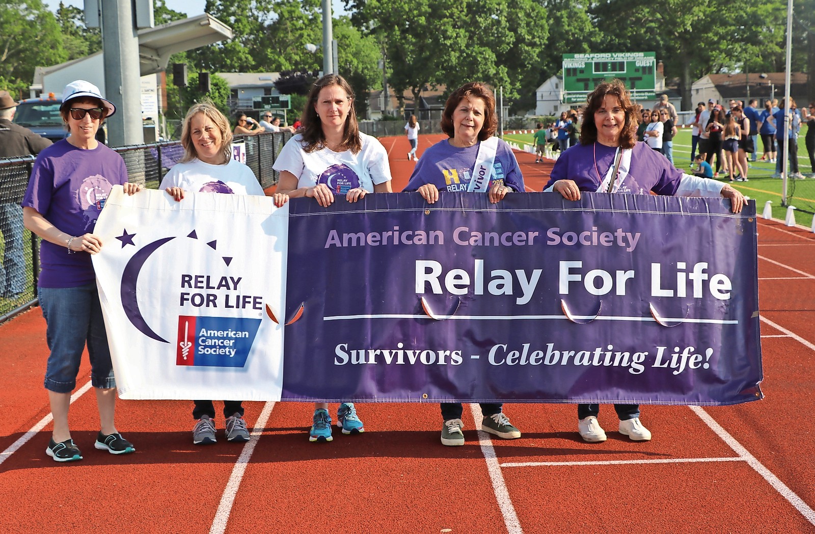 The Survivor Lap began at Seaford Relay for Life around the high school track with, from left, Carol Osa, a survivor for five years; Fern Akrish, the child of a survivor; Terry Gough, the survivor speaker; Lynn Biggiani (two years); and Carol Ross (one year).
