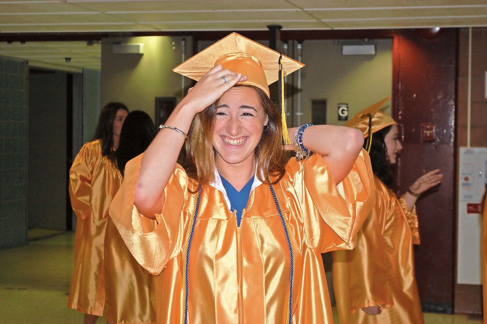 Jennifer Rodriguez made sure her cap was on straight before the ceremony began.