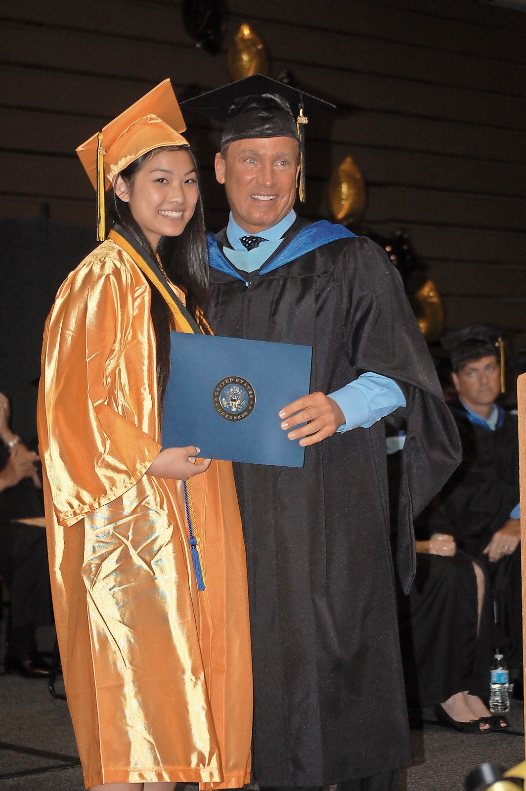 Salutatorian Sophia Liu, above left, was recognized for her achievement by Assistant Principal Jim Brown.