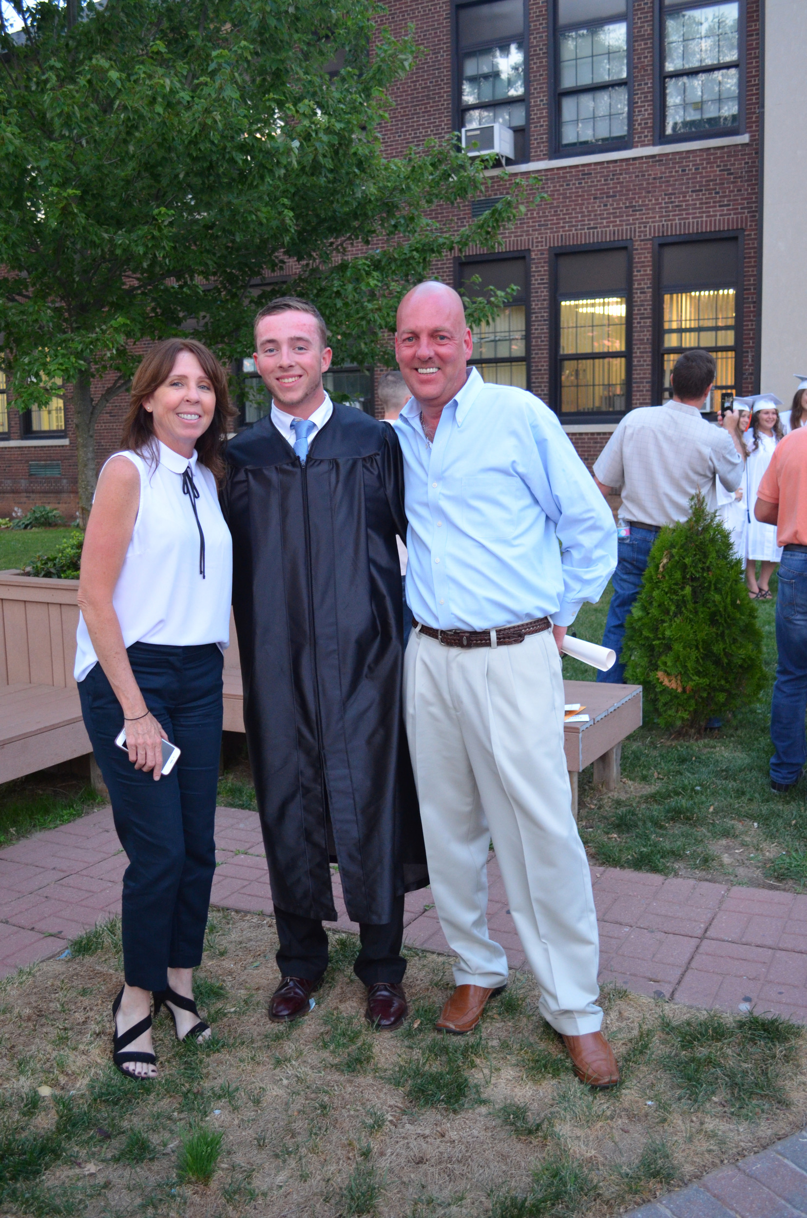Graduate Ryan Kelly with his proud parents