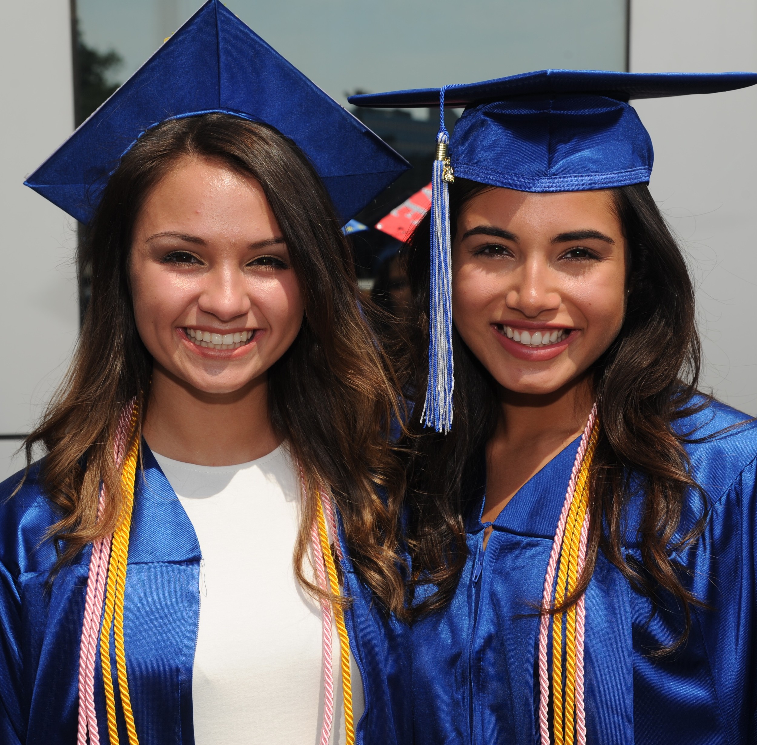 Graduating Seniors Allie Soel, 17, and Maribel Sabino,18, smiled from ear to ear during their graduation ceremony.