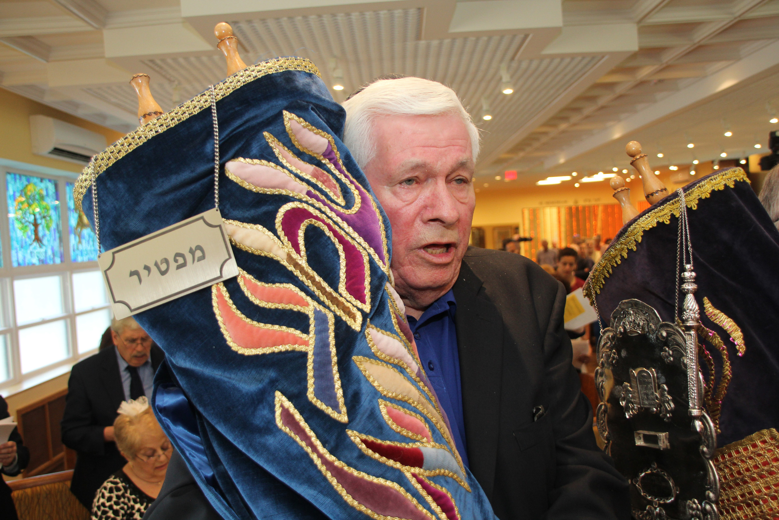 David Kamlet brought in one of the Torahs.