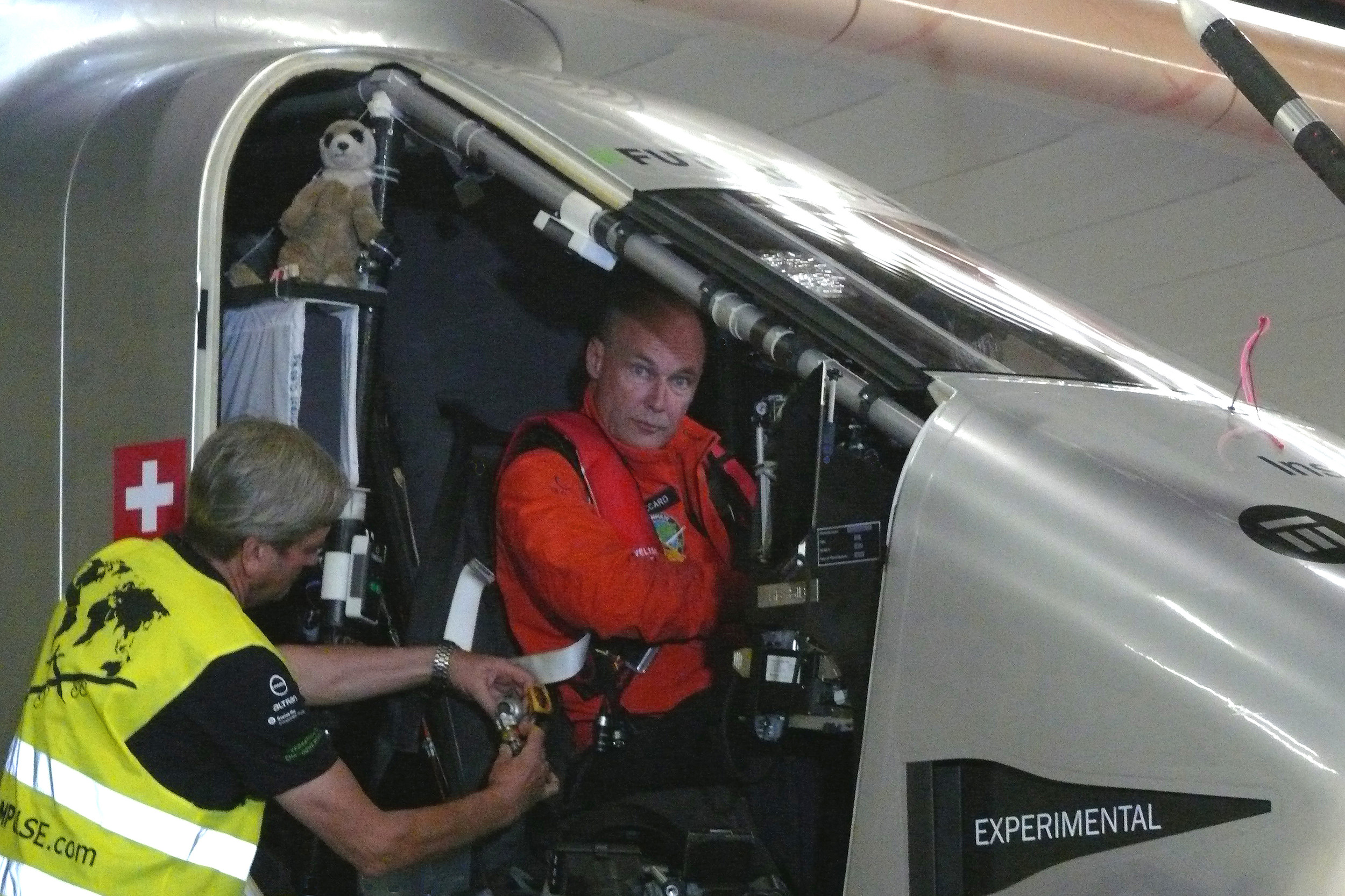 Pilot Bertrand Picard gets strapped into the Solar Impulse 2.