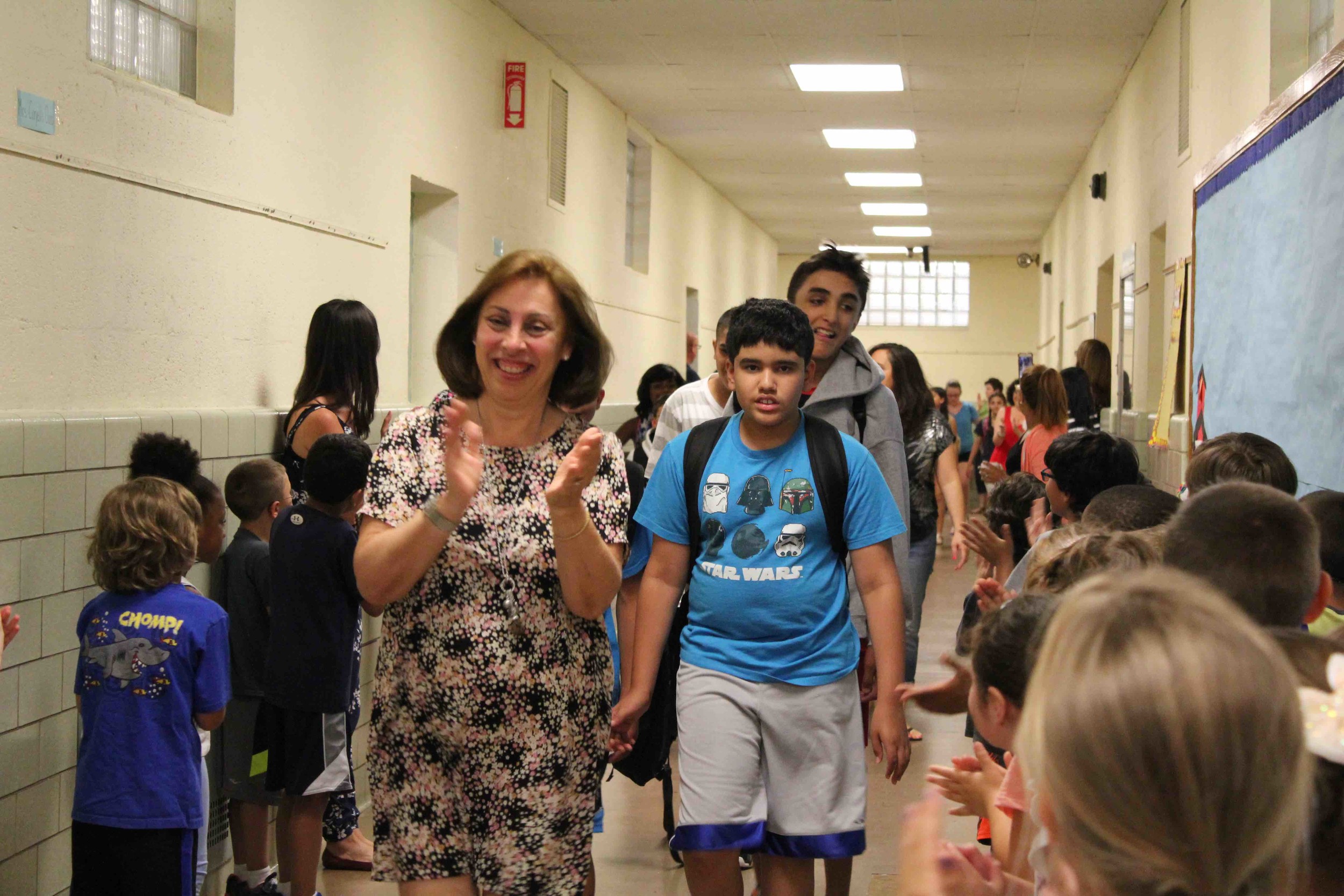 Stephanie Capozzoli led a procession of sixth-graders at the Willow Road School in June during the school’s end-of-year clap-out.