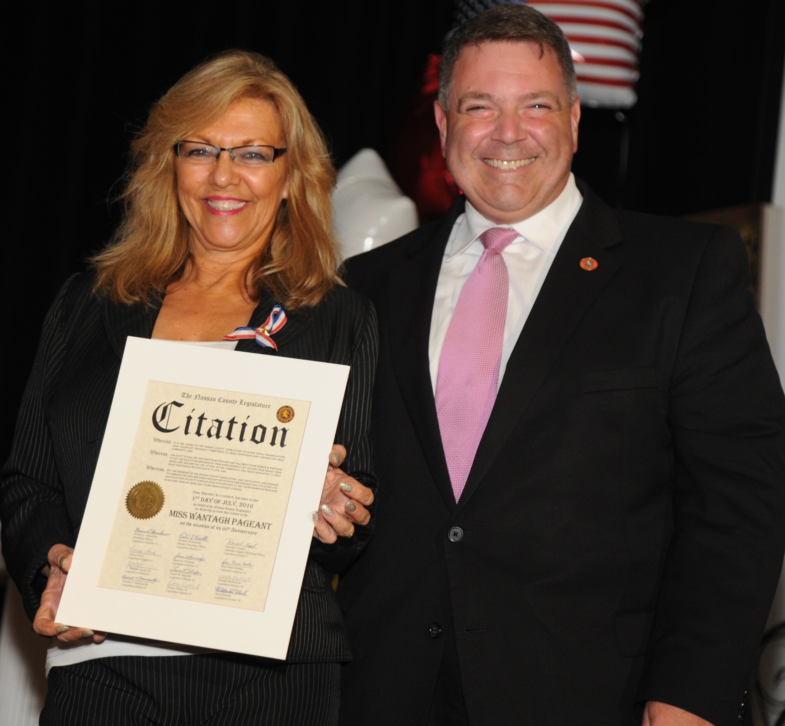 Nassau County Legislator Steven Rhoads presented a citation to Pageant Coordinator Ella Stevens.