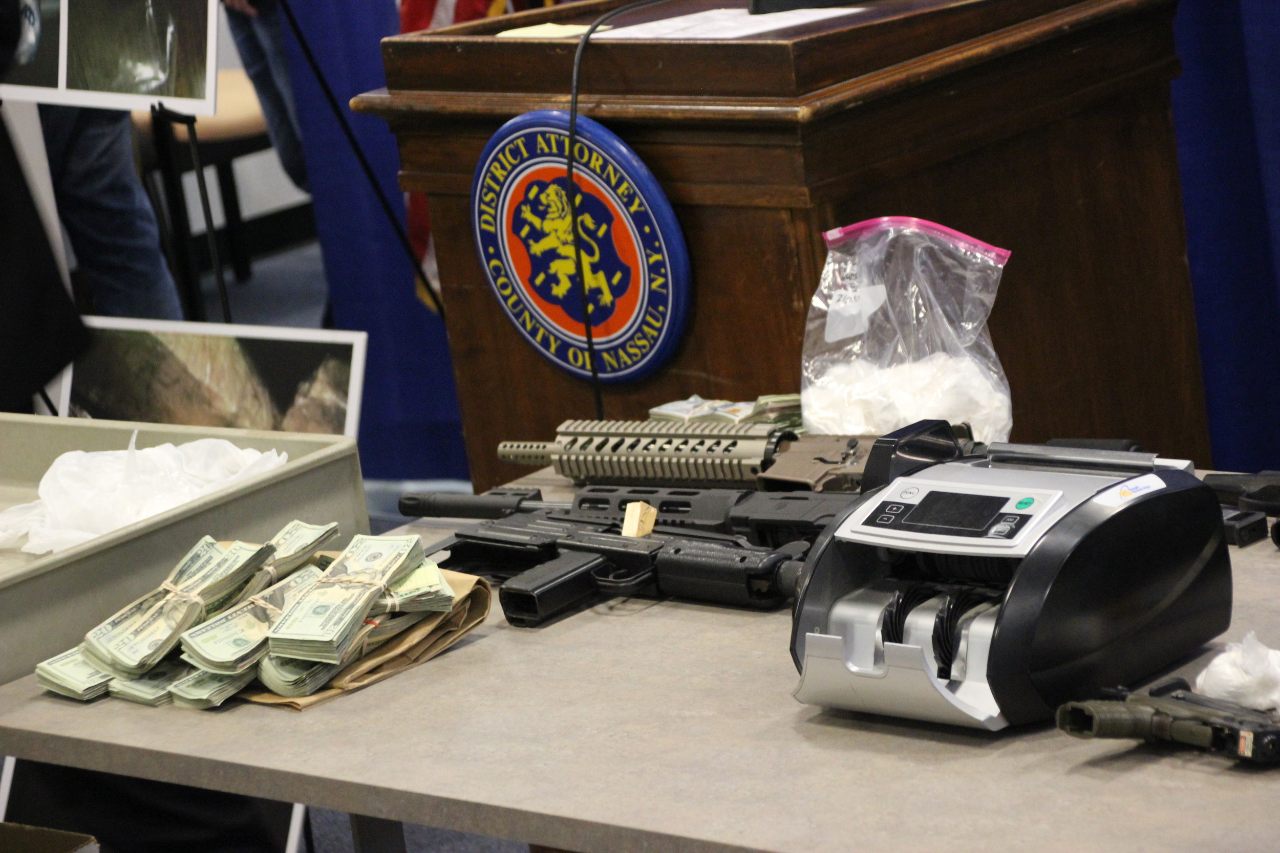 Drug paraphernalia and $75,000 cash were recovered from suspects’ residences on July 14.