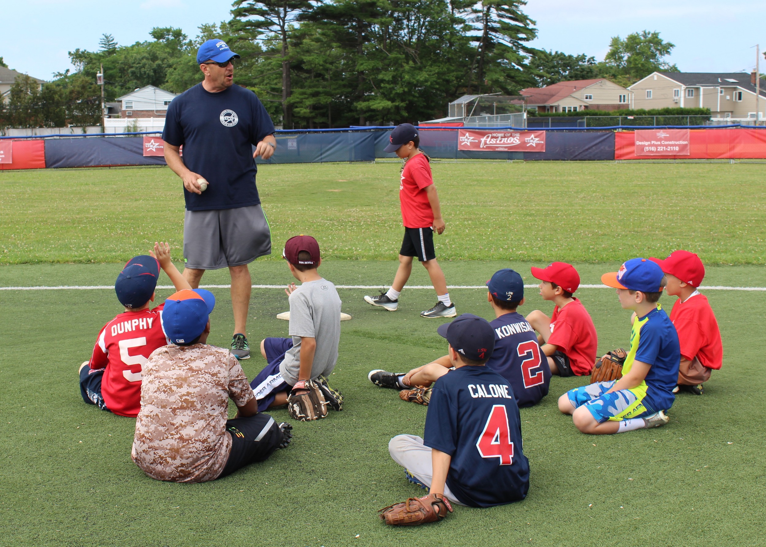 Head Counselor Mike Lesak teaches various baseball techniques to the LSW campers.