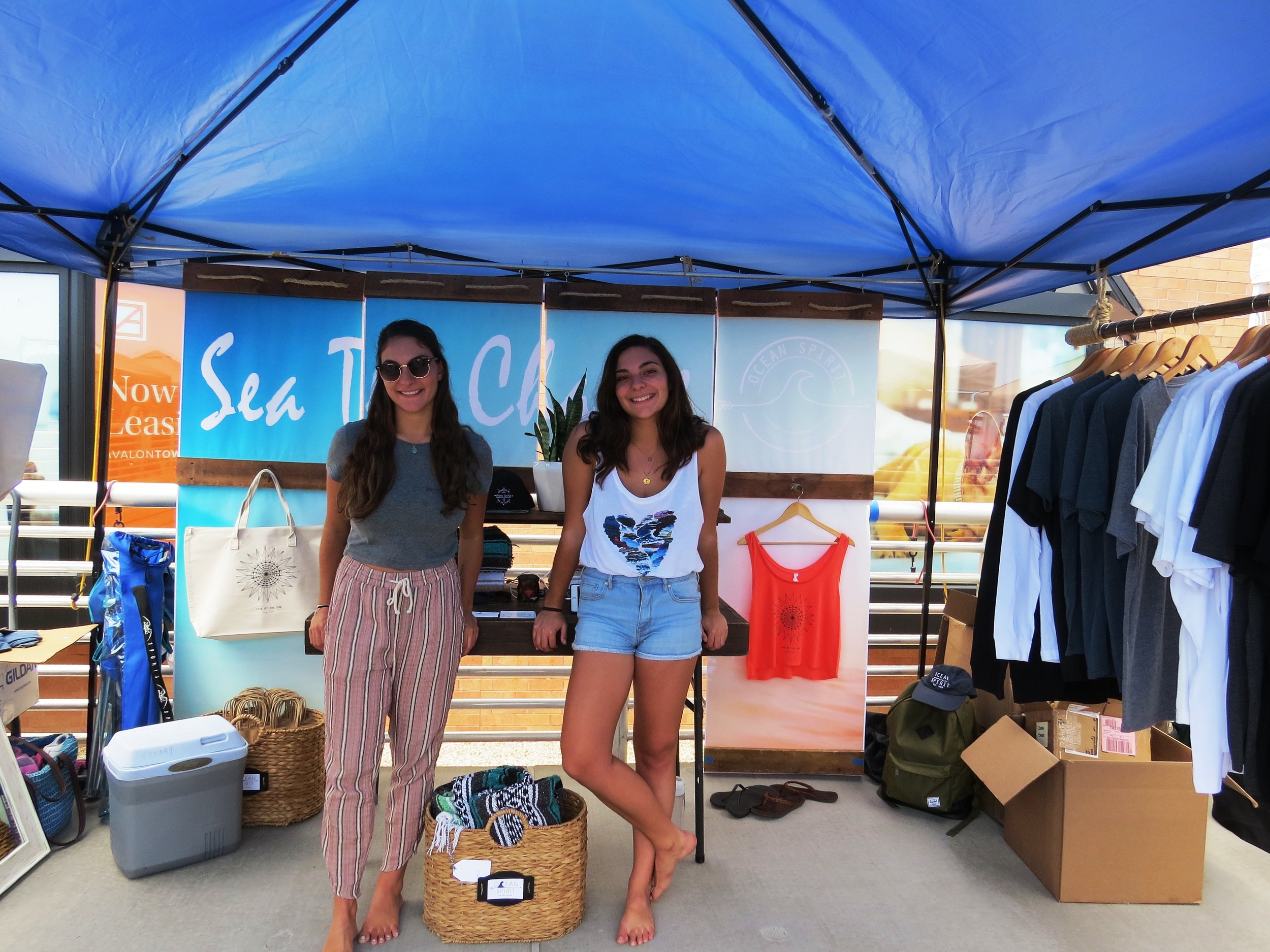 Samantha, left, and Emily Febrizio display their Ocean Spirit product line at the Long Beach Boardwalk Craft Fair earlier this month.