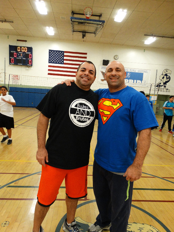 Mignella, right, and MJHS Assistant Principal John Squadrito at the Memorial Junior High School community volleyball game in November 2015.