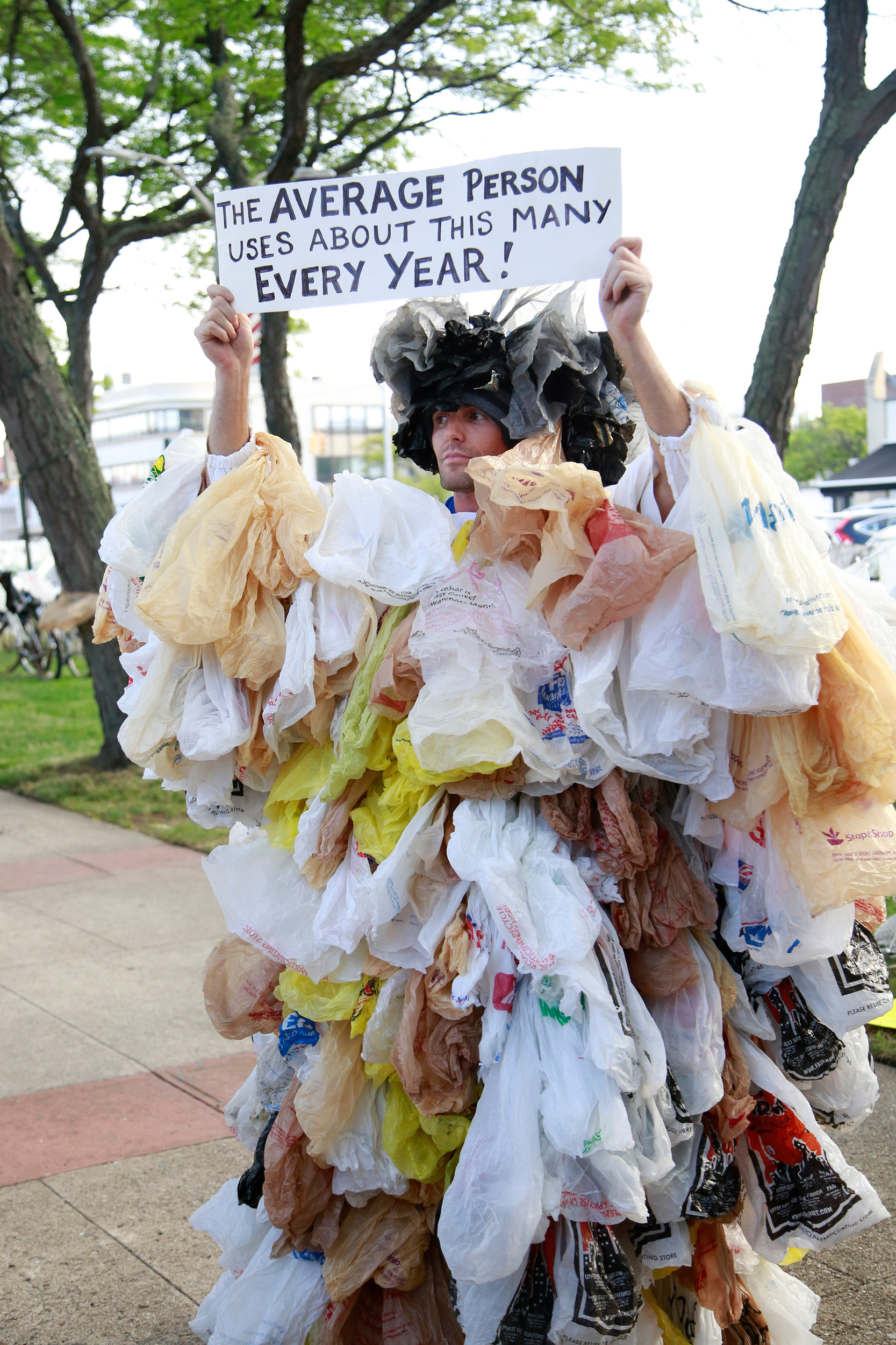 Long Beach resident Joseph Naham stuck hundreds of plastic bags to his body to show how many bags the average person uses in a year.