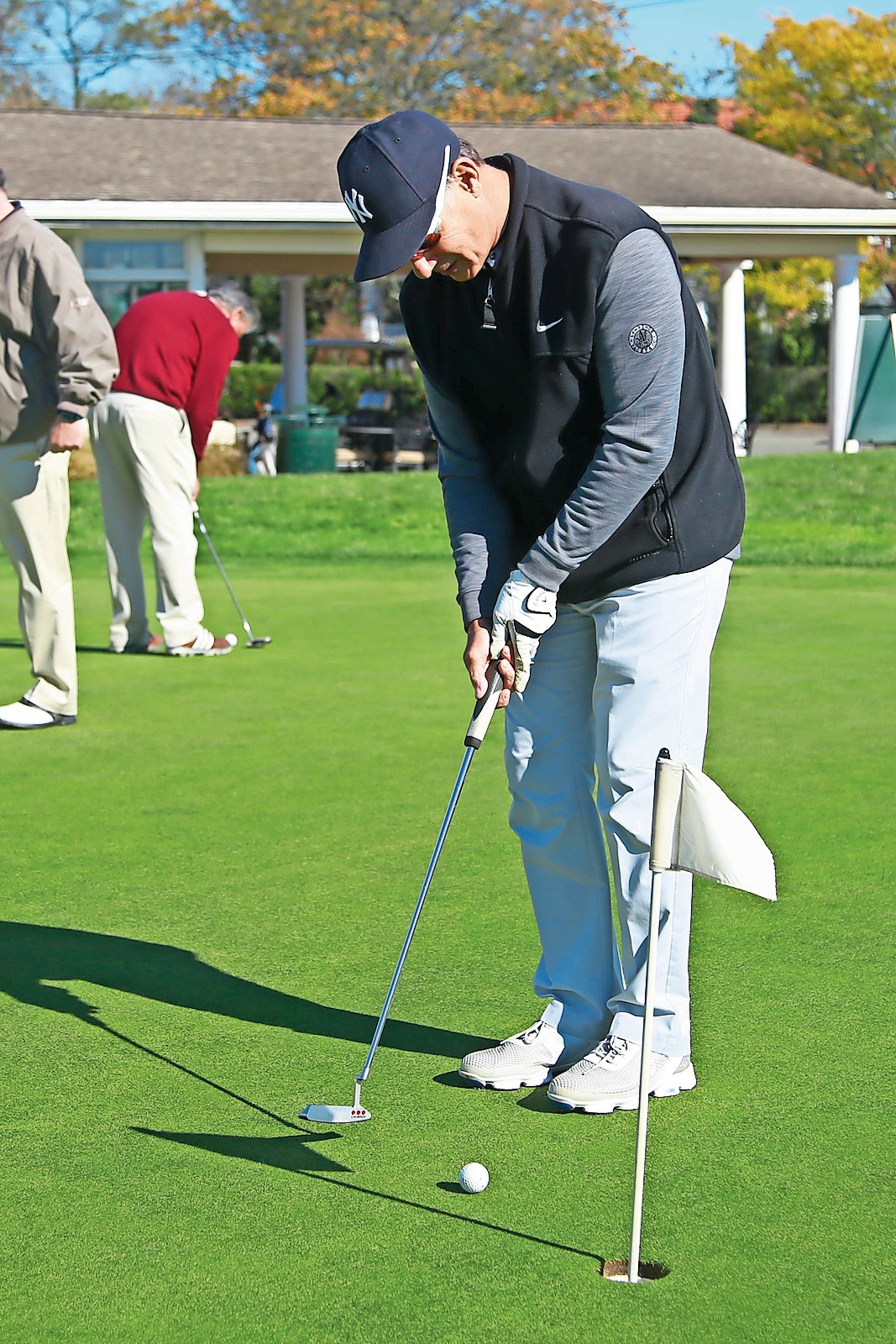 Malverne resident Jim Papazis of Malverne practiced his putting prior to the golf tournament on Oct. 31.