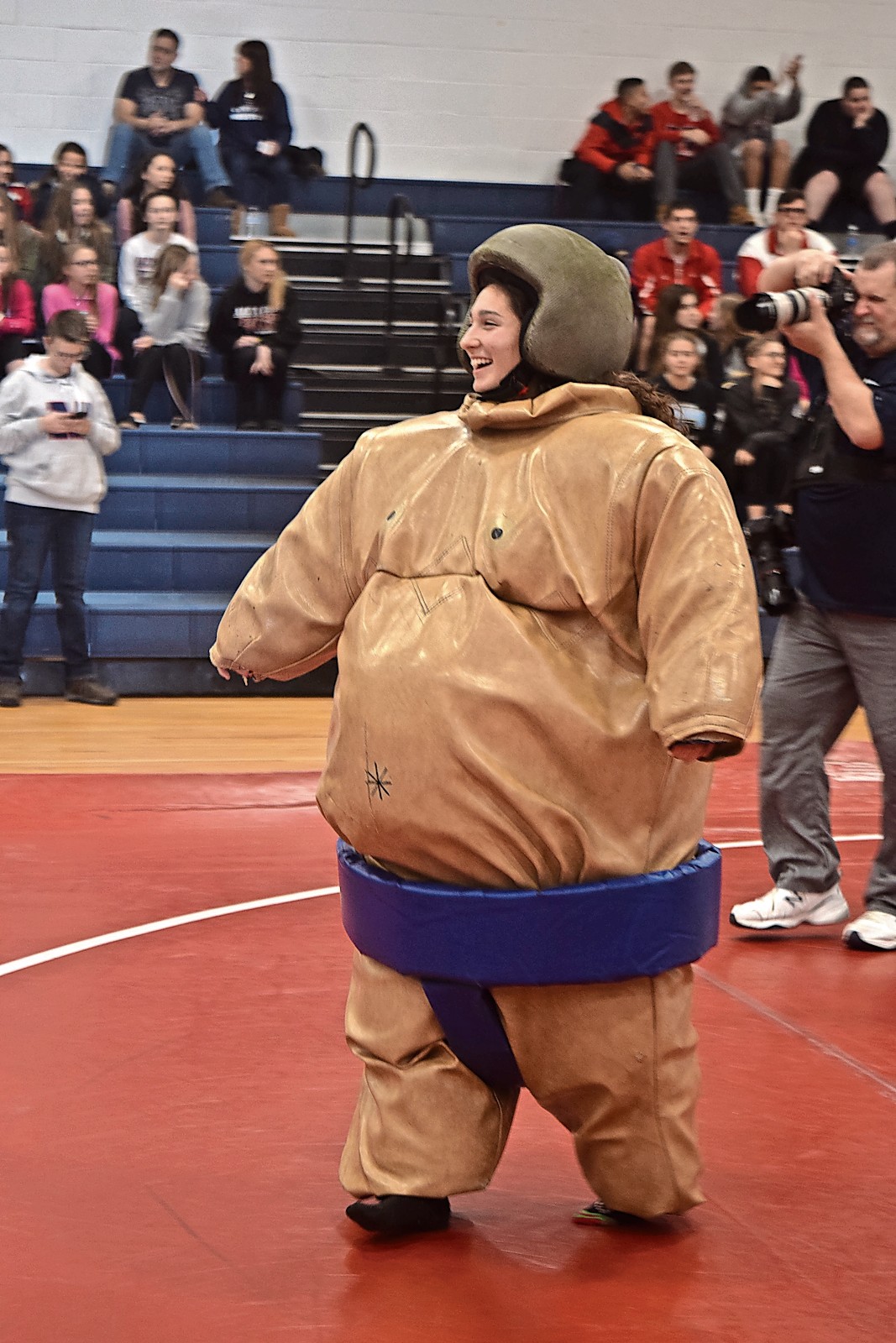 Victoria DiMartino, a MacArthur senior and soccer player, prepared to wrestle against a teammate.