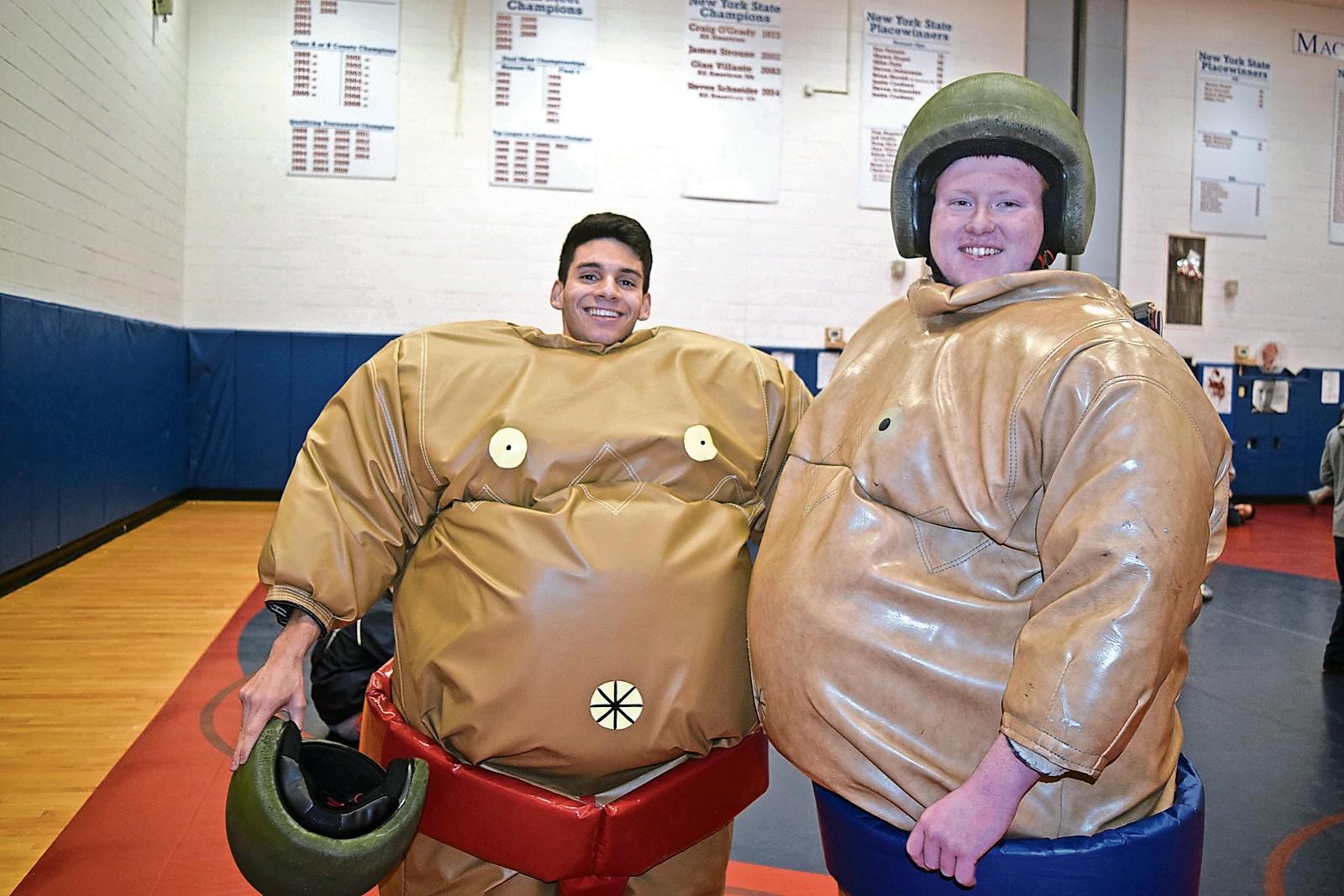 Seniors Matt Silva, left, and John Deegan said that they had fun while sumo wrestling at the tournament last Wednesday.