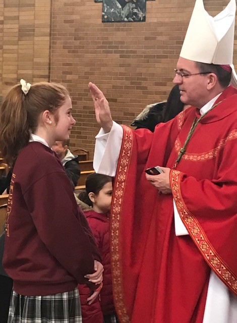 Newly installed Bishop John Barres made a surprise visit to St. Raymond’s Parochial School in East Rockaway to celebrate the closing mass in honor of Catholic Schools Week.