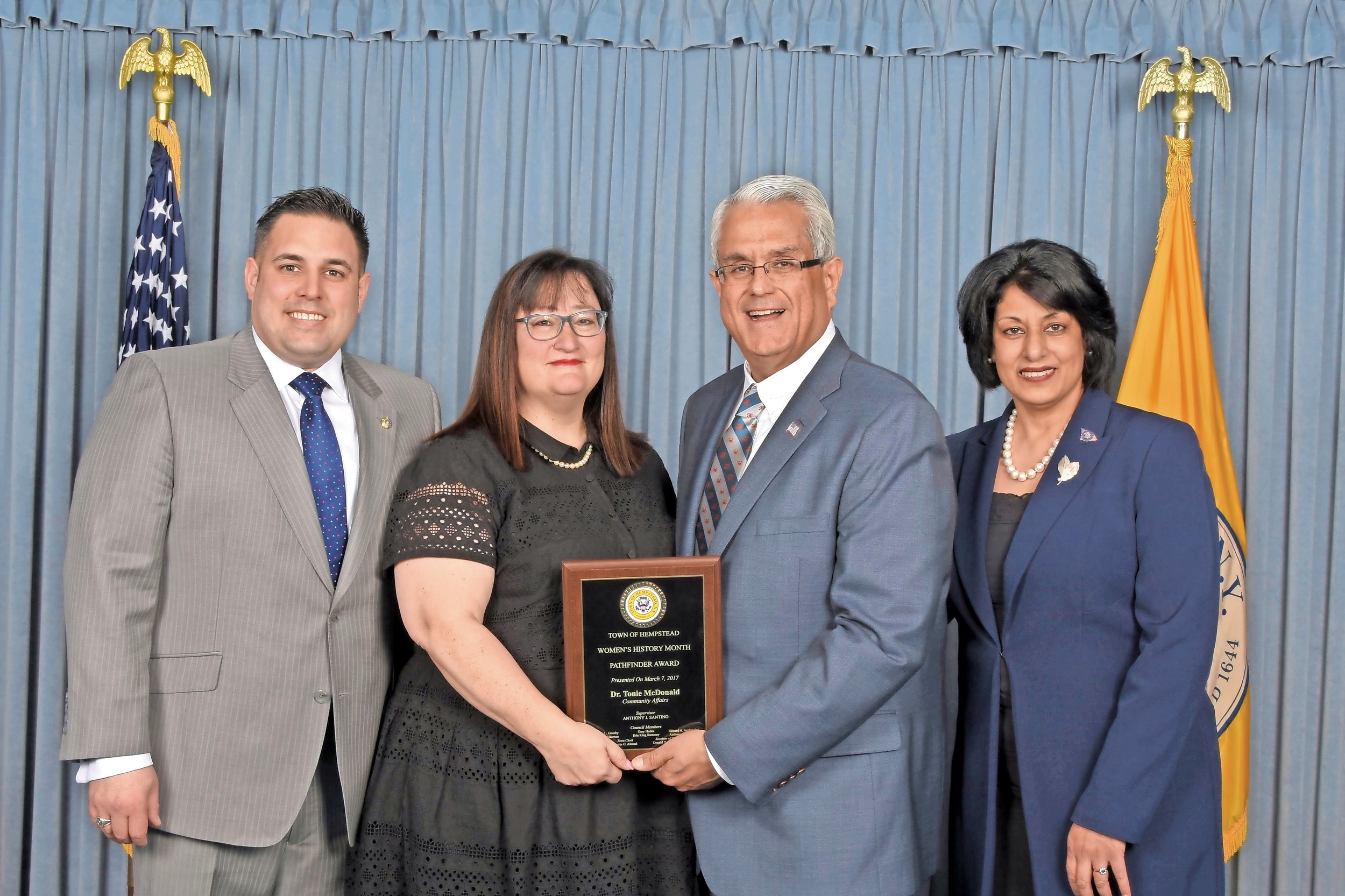 Dr. Tonie McDonald, center, the superintendent of the Levittown School District, won the Town of Hempstead Pathfinder Award. Councilman Anthony D’Esposito, left, Supervisor Anthony Santino and Town Clerk Nasrin Ahmad commended McDonald for her commitment to the community.