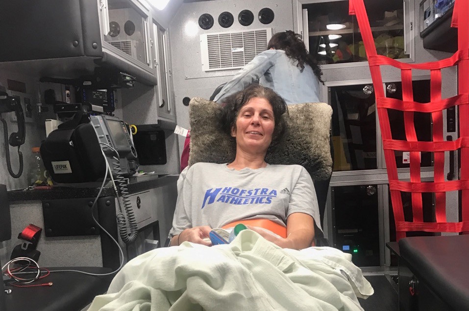Wantagh Fire Department officials picked up Christine Newins, a 52-year-old Levittown resident and community volunteer in north Wantagh and Seaford, from the airport when she returned from rehabilitation for life-threatening injuries she sustained in a car accident in Carlsbad, Calif.