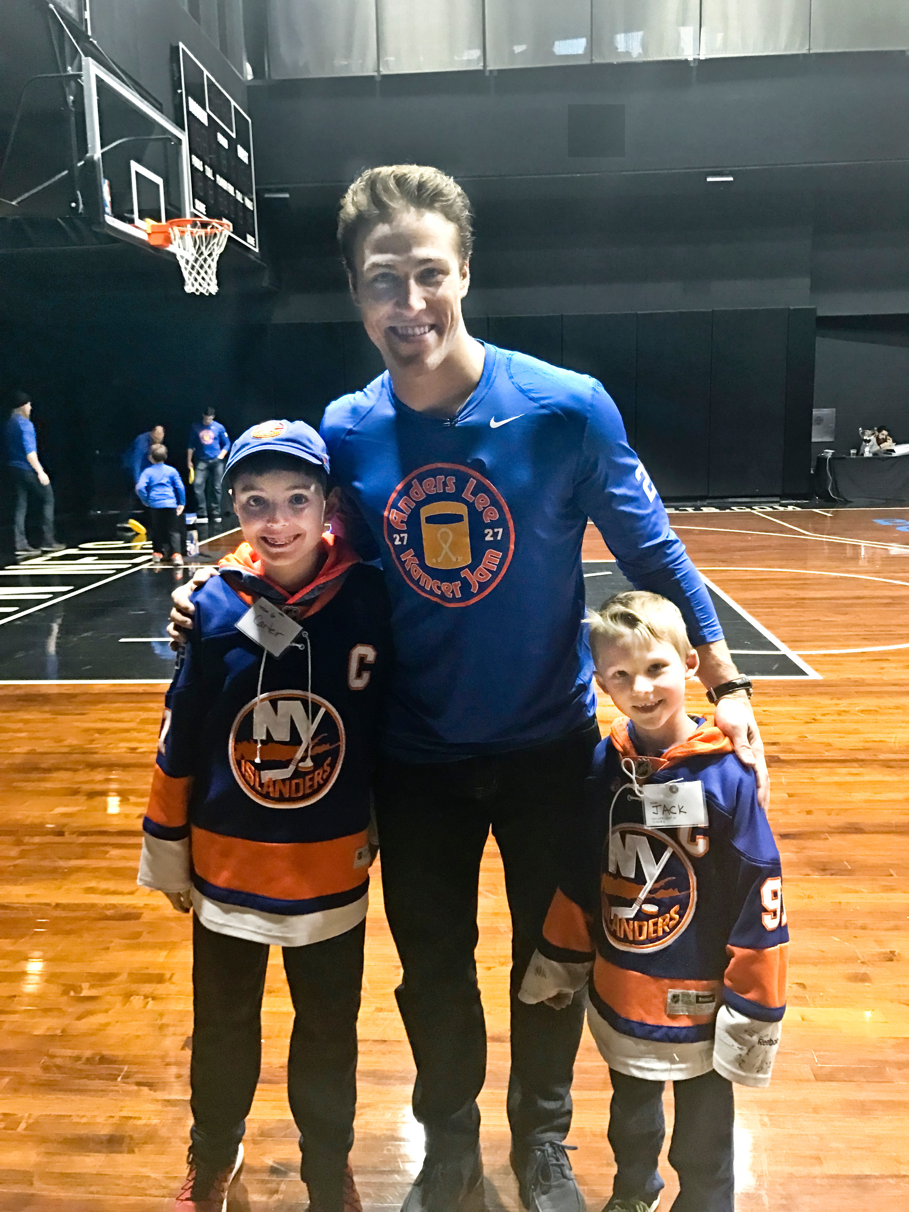 Carter LaCorte, left, of Northport, and Jack Doran, of Lynbrook, met Islanders forward Anders Lee at his inaugural Kancer Jam event and mingled with other NHL players after raising more than $2,600 for a Queens children’s medical center.