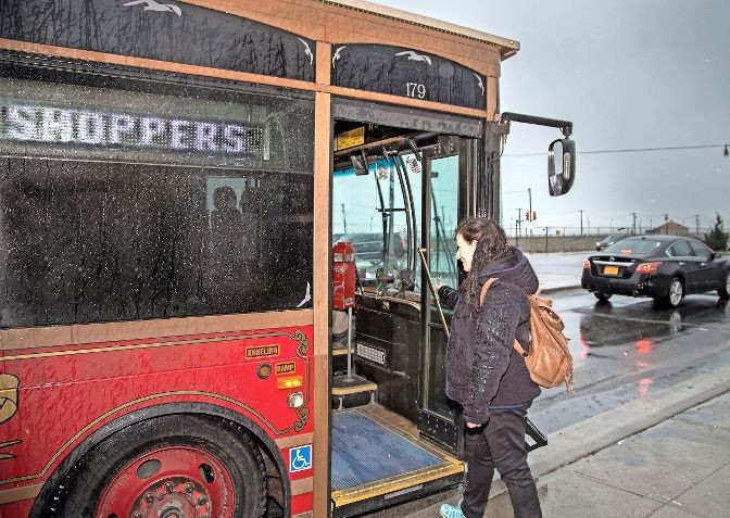 J. Anderson boarding the Shoppers Special at Long Beach Road and Broadway on her way to Stop & Shop. The city is also looking to reduce service on the Shoppers Special, which provides transportation to shopping districts in the east and west ends.