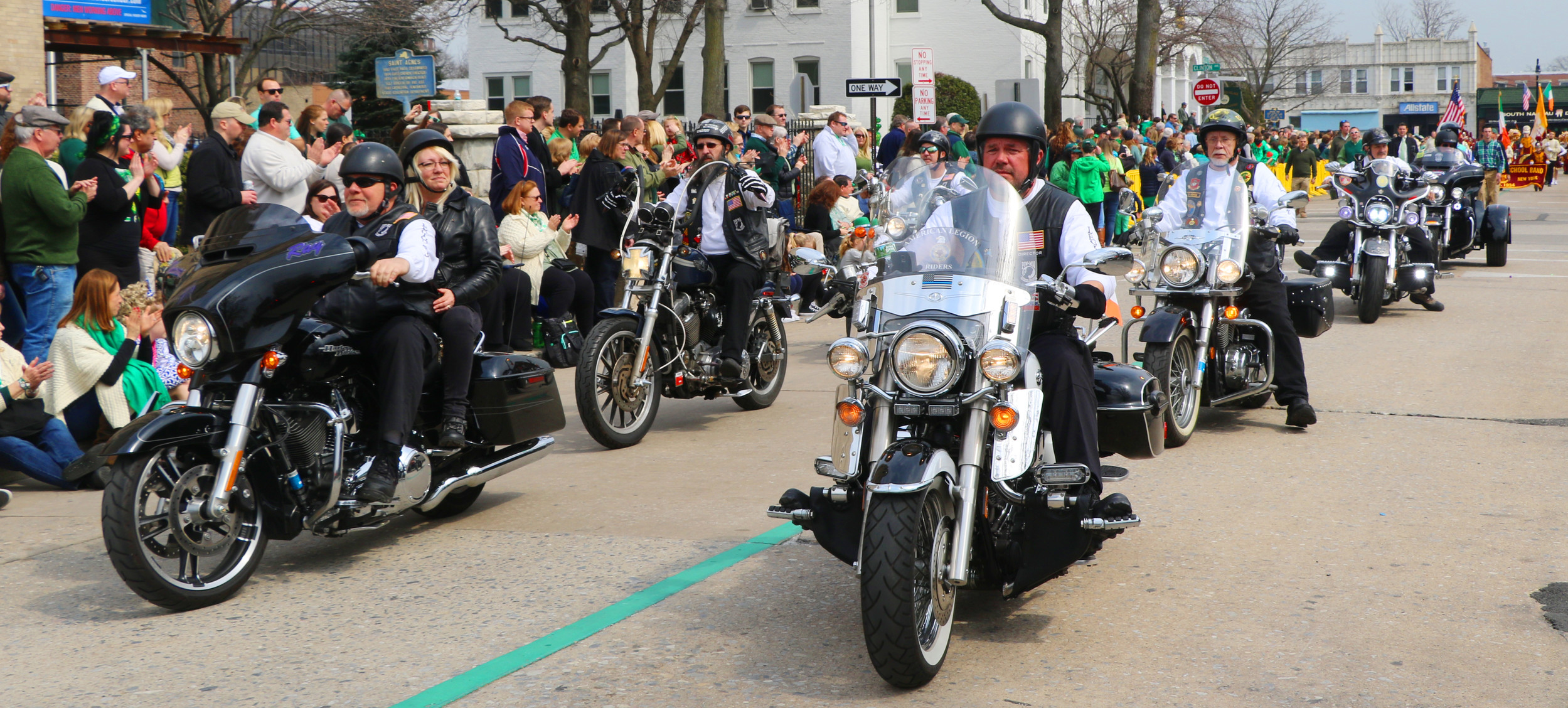 Various members of the American Legion ride together on their motorcycles.