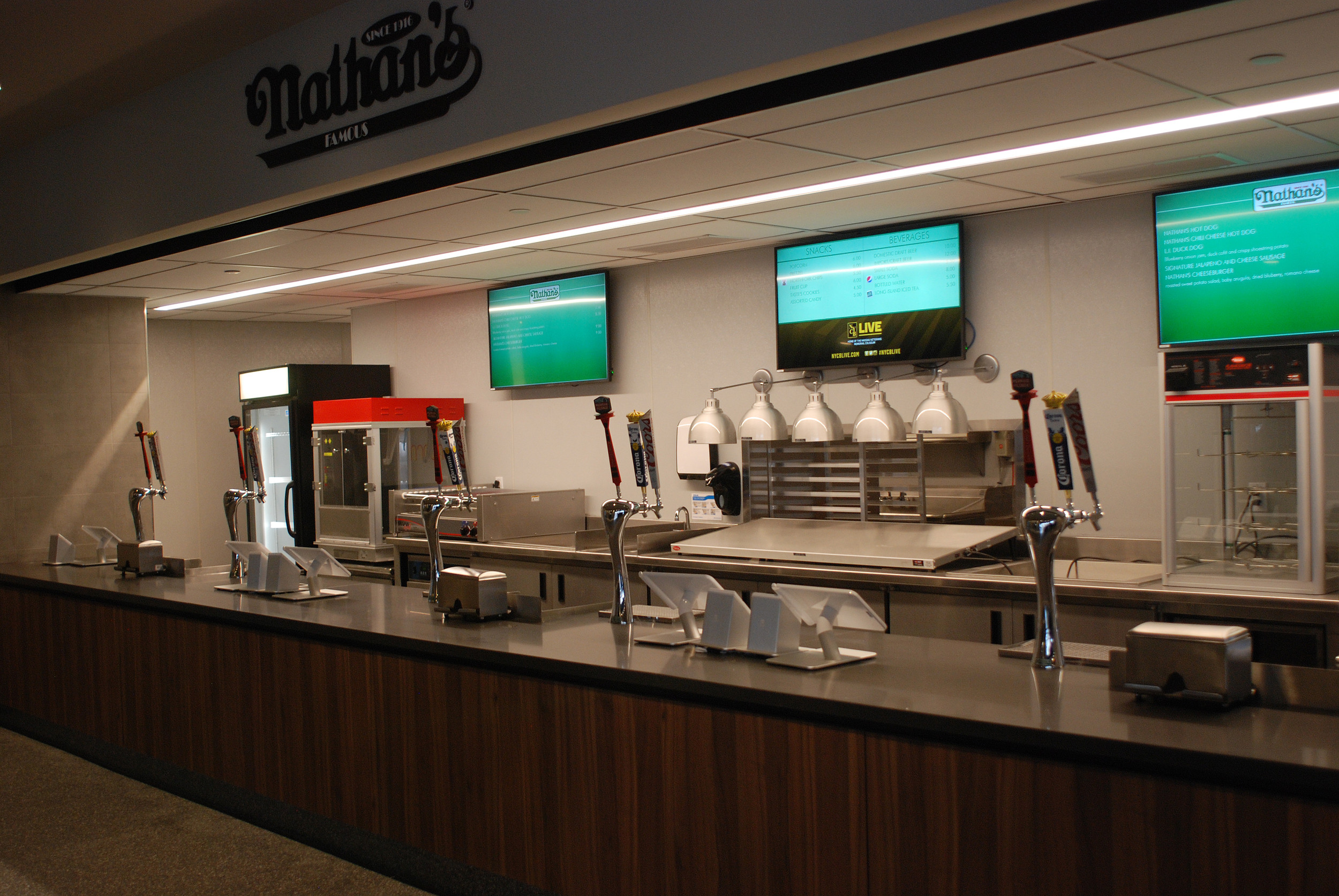 The Nathan's concession stand, front and center at the entrance to the Coliseum, awaits atendees.