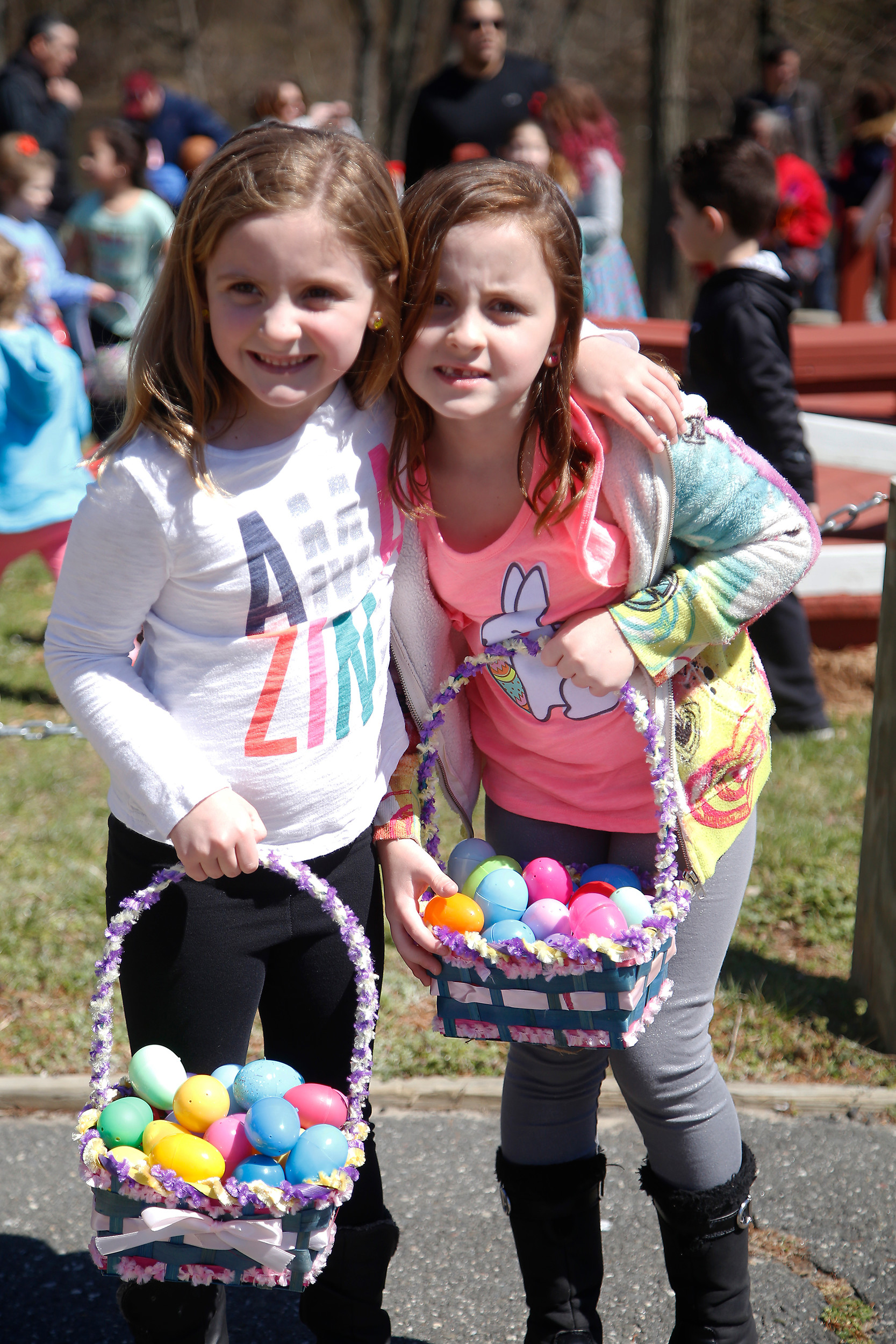 Sisters Maya Krudler, 6, left, and Gianna Krudler, 7, had fun teaming up at the egg hunt.