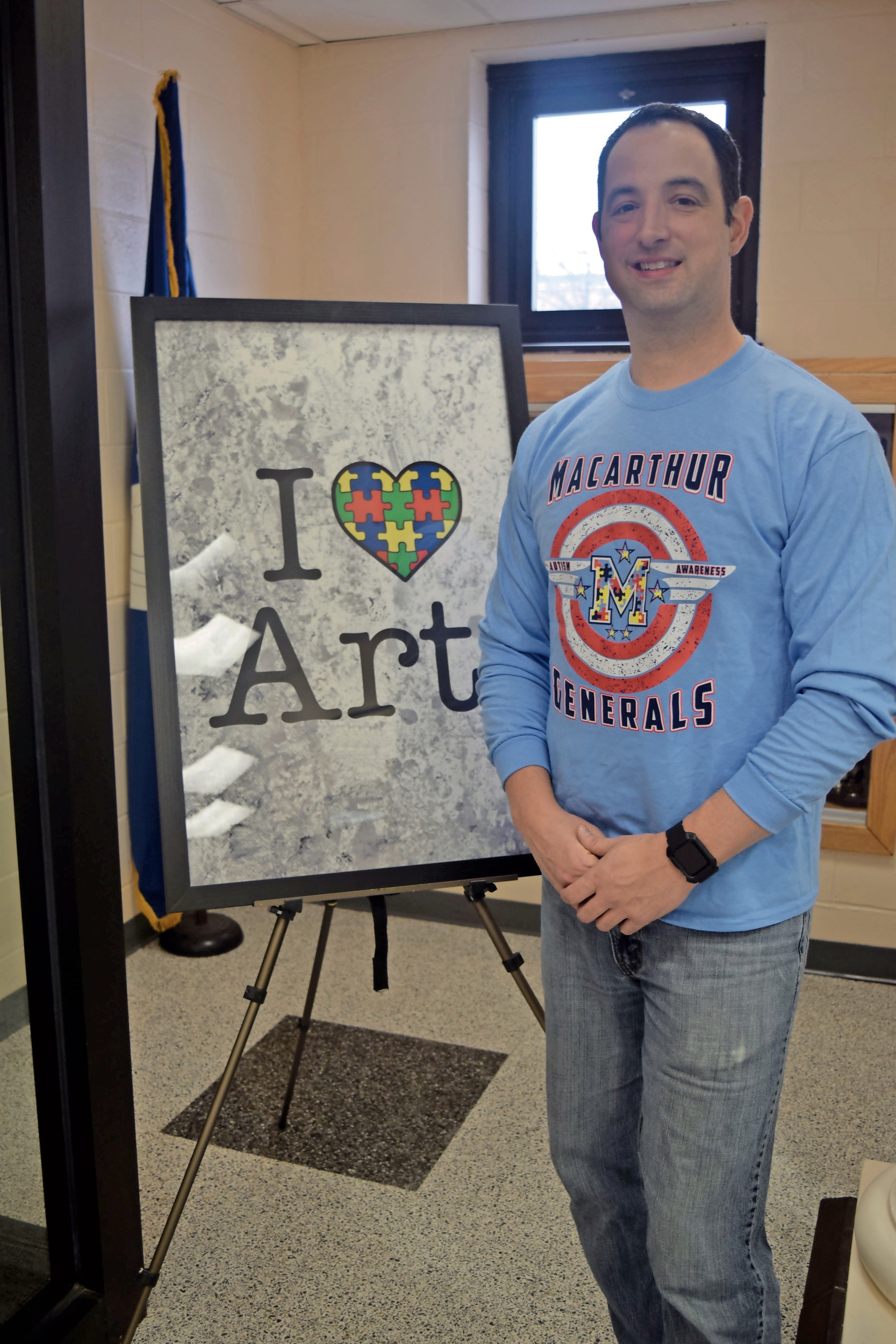 Vincent Causeman, a MacArthur High School social studies teacher, spearheads projects and events to raise awareness of autism and similar disorders in the high school and community.