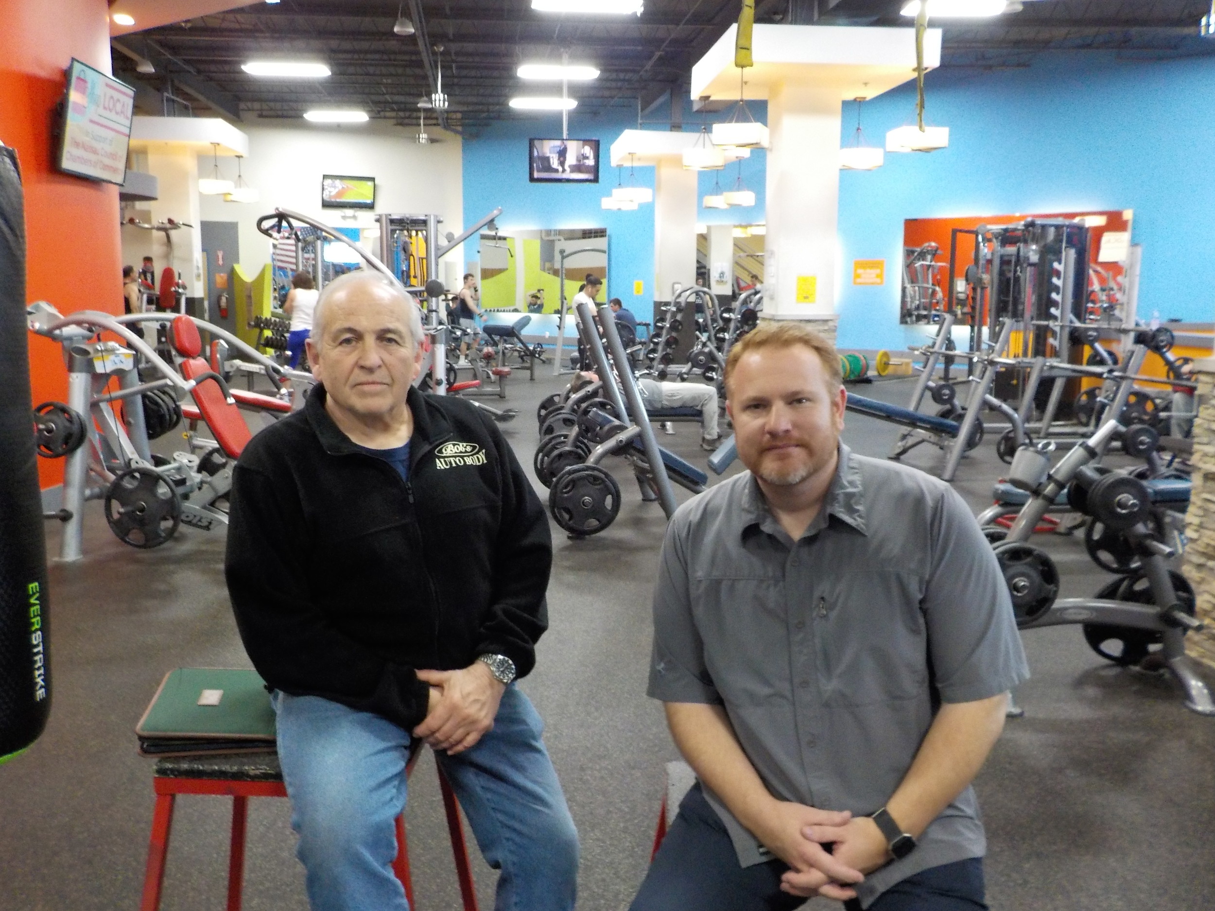 ROK Health & Fitness owners Robert D’Urso, left, and Mike Hawksby decided to give back to their members in  the form of rebate checks while celebrating their gym’s fifth anniversary.