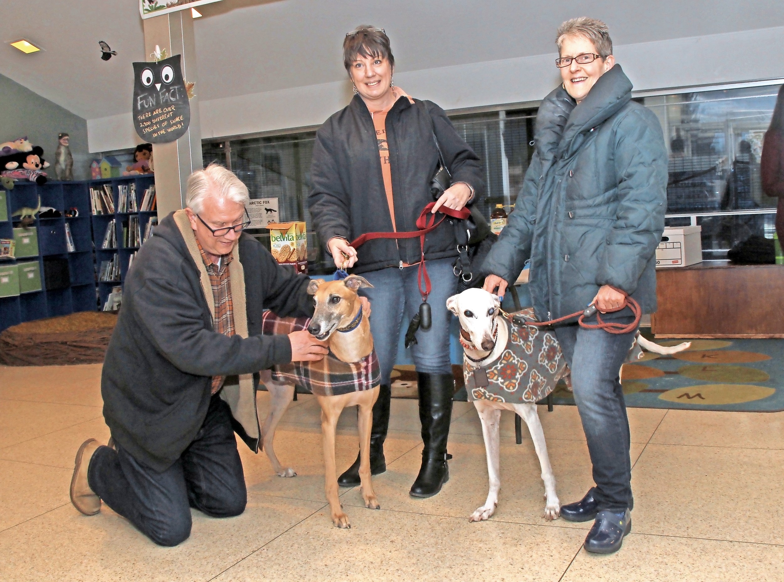 Peter Ruffner, left, a Friends of Tackapausha board member, met Liz Perry and her greyhound, Murphy; and Nancy Nelson and her dog, Pablo.