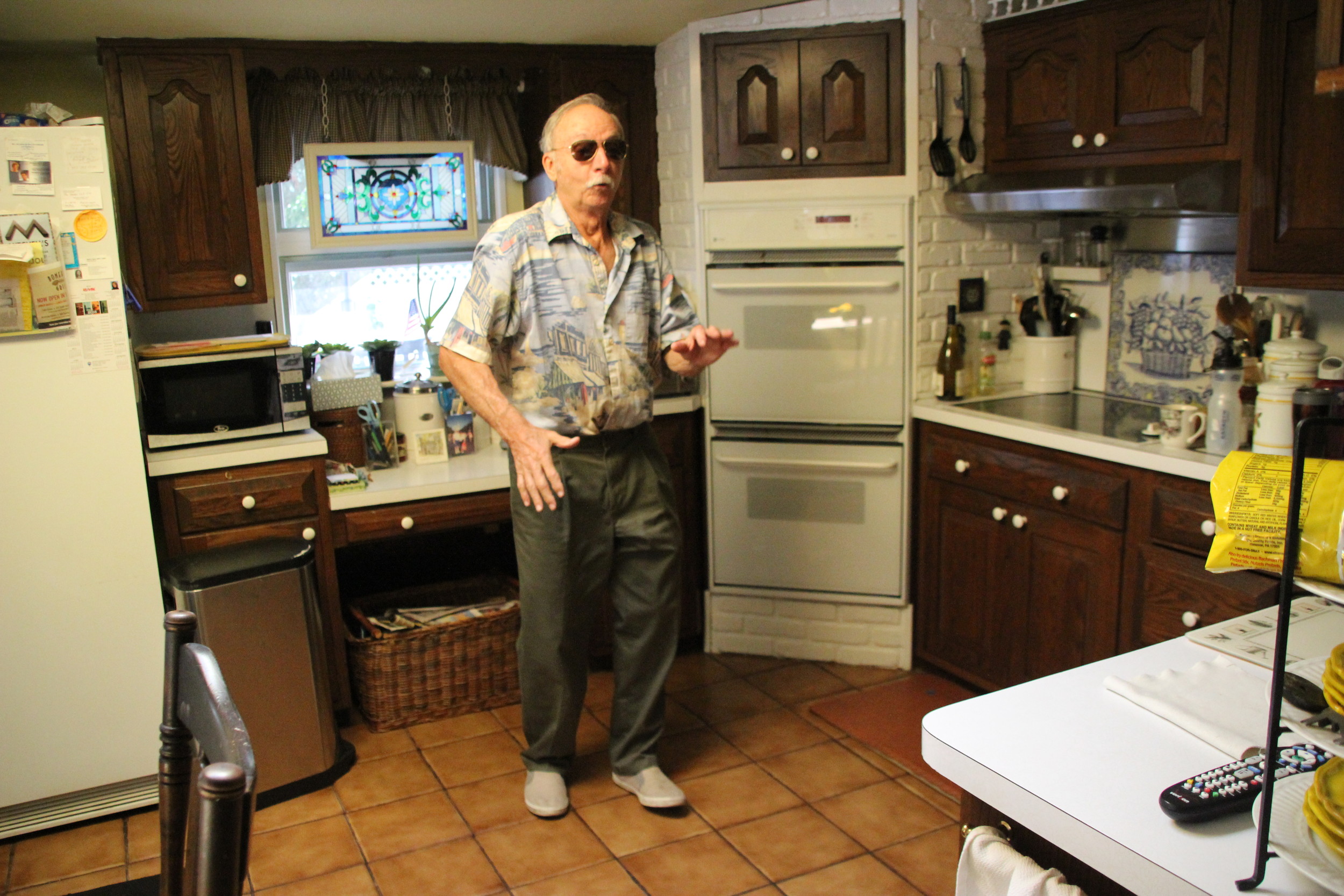 Ferrara demonstrated salsa technique in his kitchen.