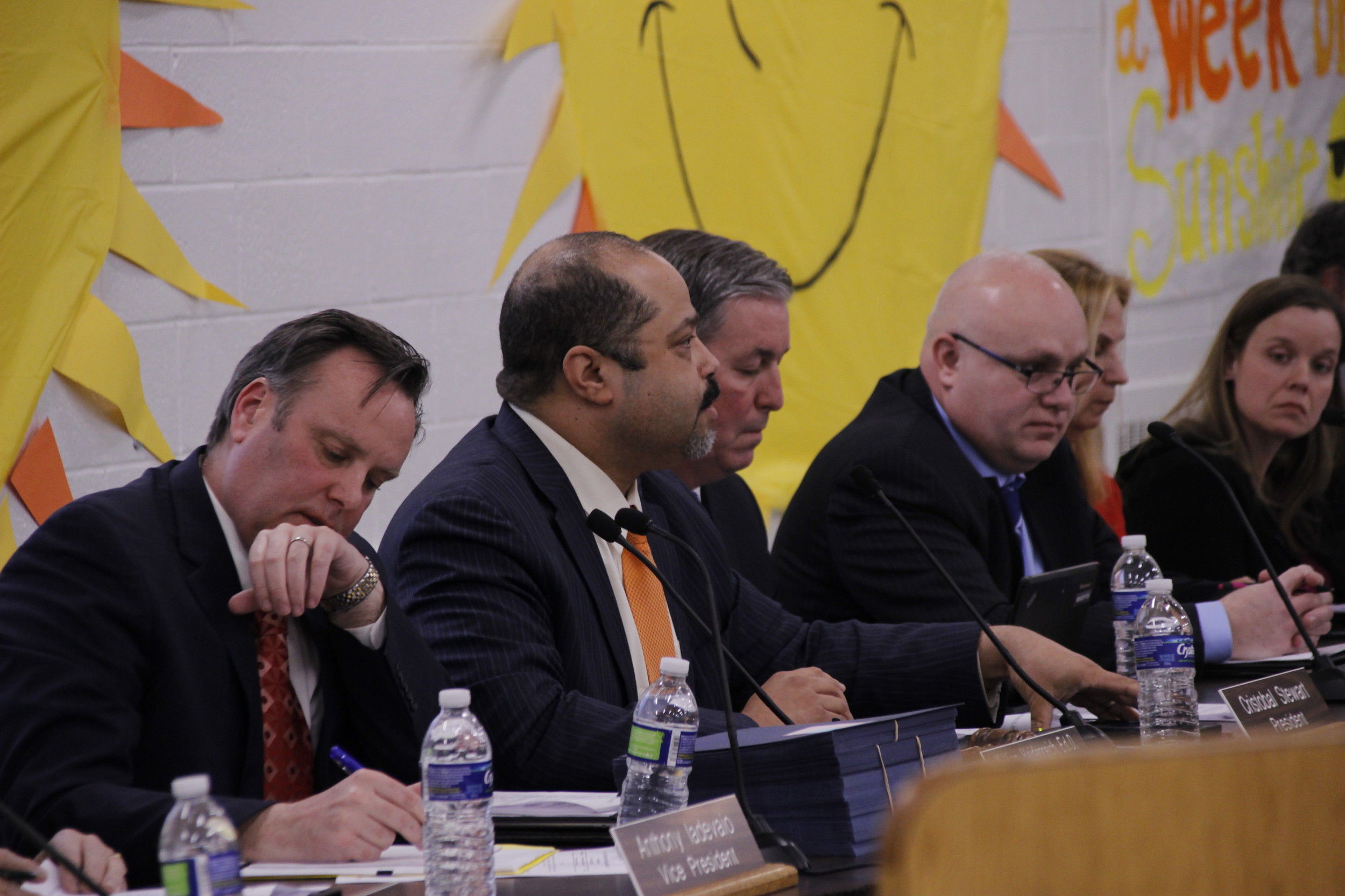 Cristobal Stewart, second from left, at a Board of Education meeting in February.