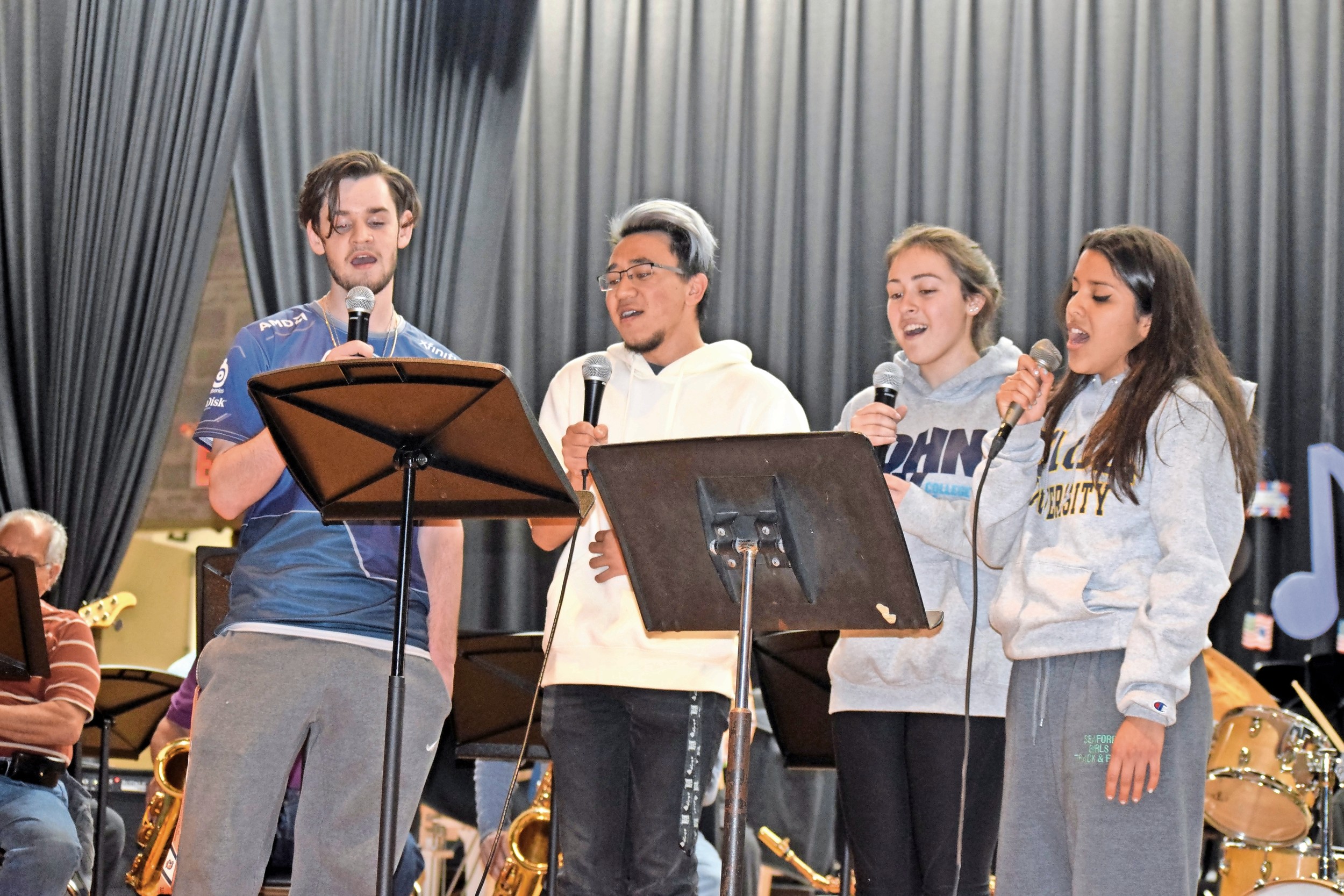 Seaford High School seniors sang in the chorus at the band’s annual spring concert on May 13. Scott Wilson, left, Christopher Ho, Kayla Marino and Elissa Castro performed.