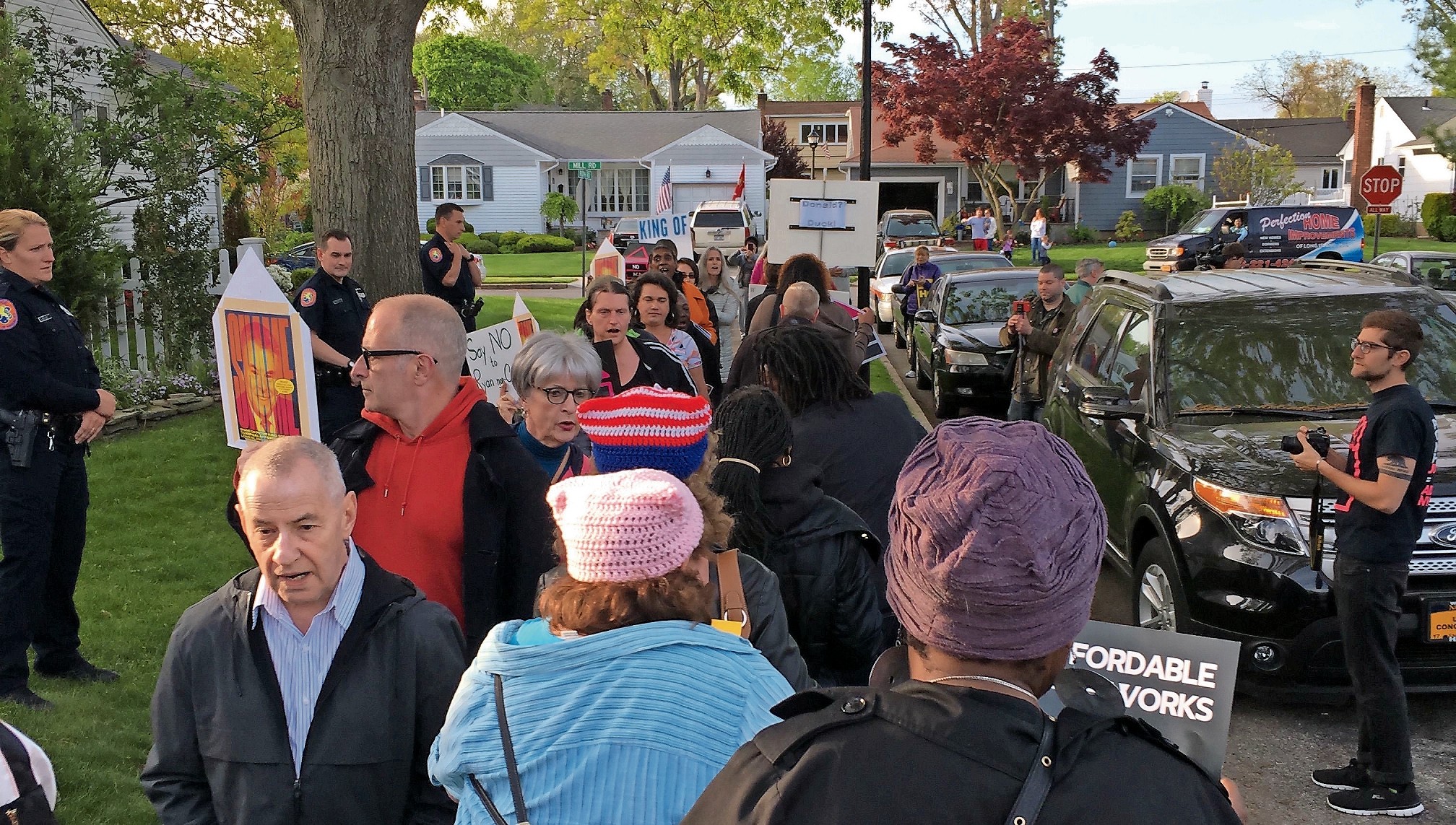 The demonstration was confined to the sidewalk on Roth Road, where King lives. The congressman was not home when protesters gathered outside his house.