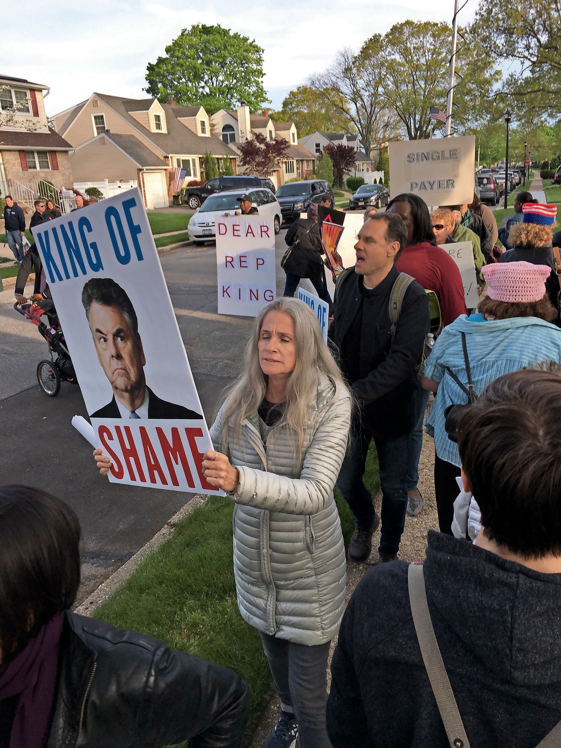 Long Island and New York City residents protested outside U.S. Rep. Peter King’s home in Seaford on May 11.