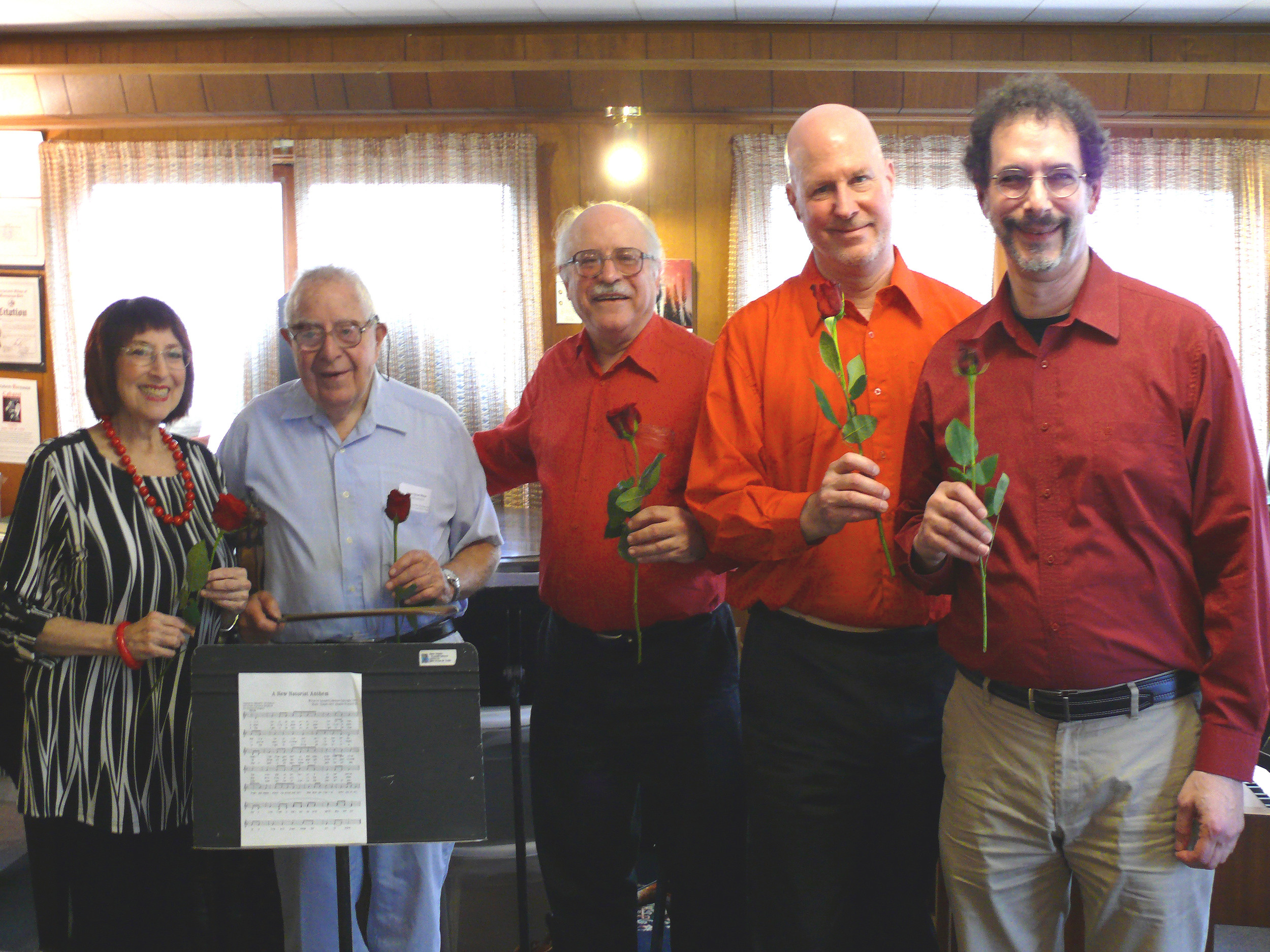 Roses were passed around after the concert performance Helene Williams, left, Nathaniel S. Lehrman, Leonard Lehrman, Kurt Behnke and Daniel Hyman.